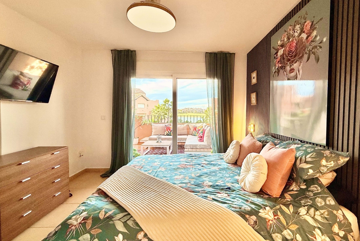 2-Bed Elegant Apartment master bedroom with terrace access and lake views at Mar Menor Golf Resort, offered by Levante Properties.