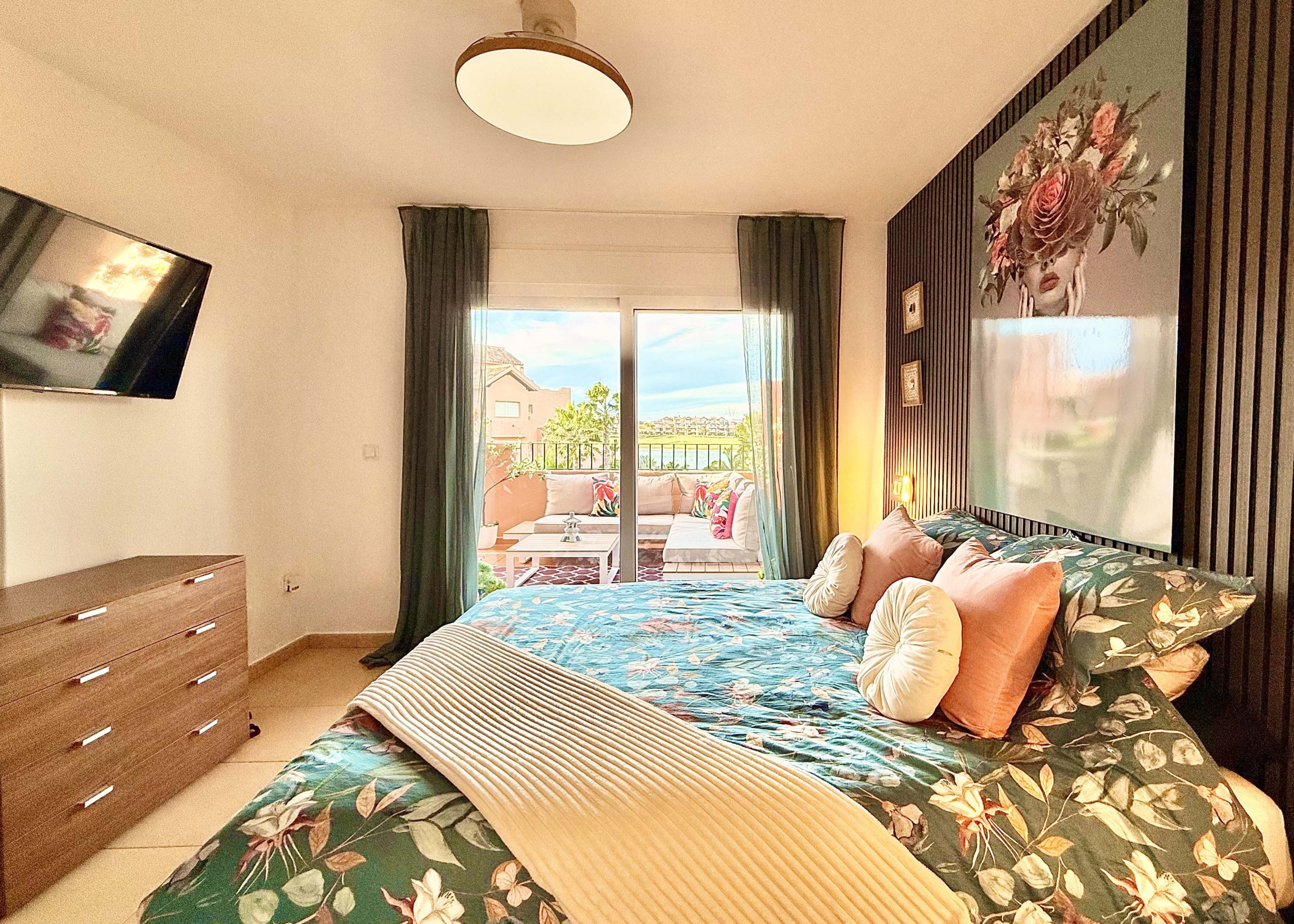 2-Bed Elegant Apartment master bedroom with terrace access and lake views at Mar Menor Golf Resort, offered by Levante Properties.