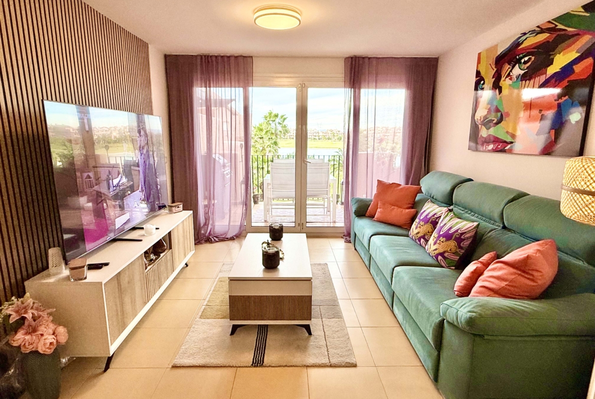 2-Bed Elegant Apartment bright open-plan living room with terrace access in a Levante Properties listing at Mar Menor Golf Resort.