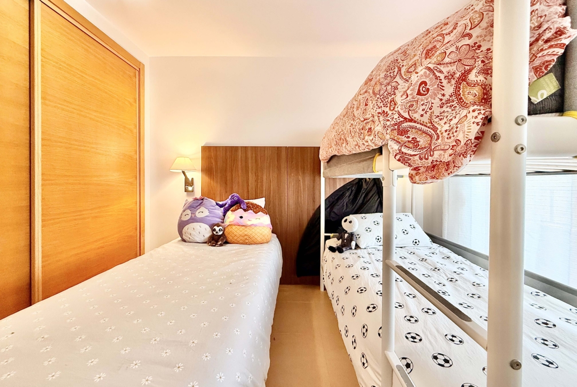 2-Bed Elegant Apartment second bedroom with private terrace and resort views at Mar Menor Golf Resort, Levante Properties listing.