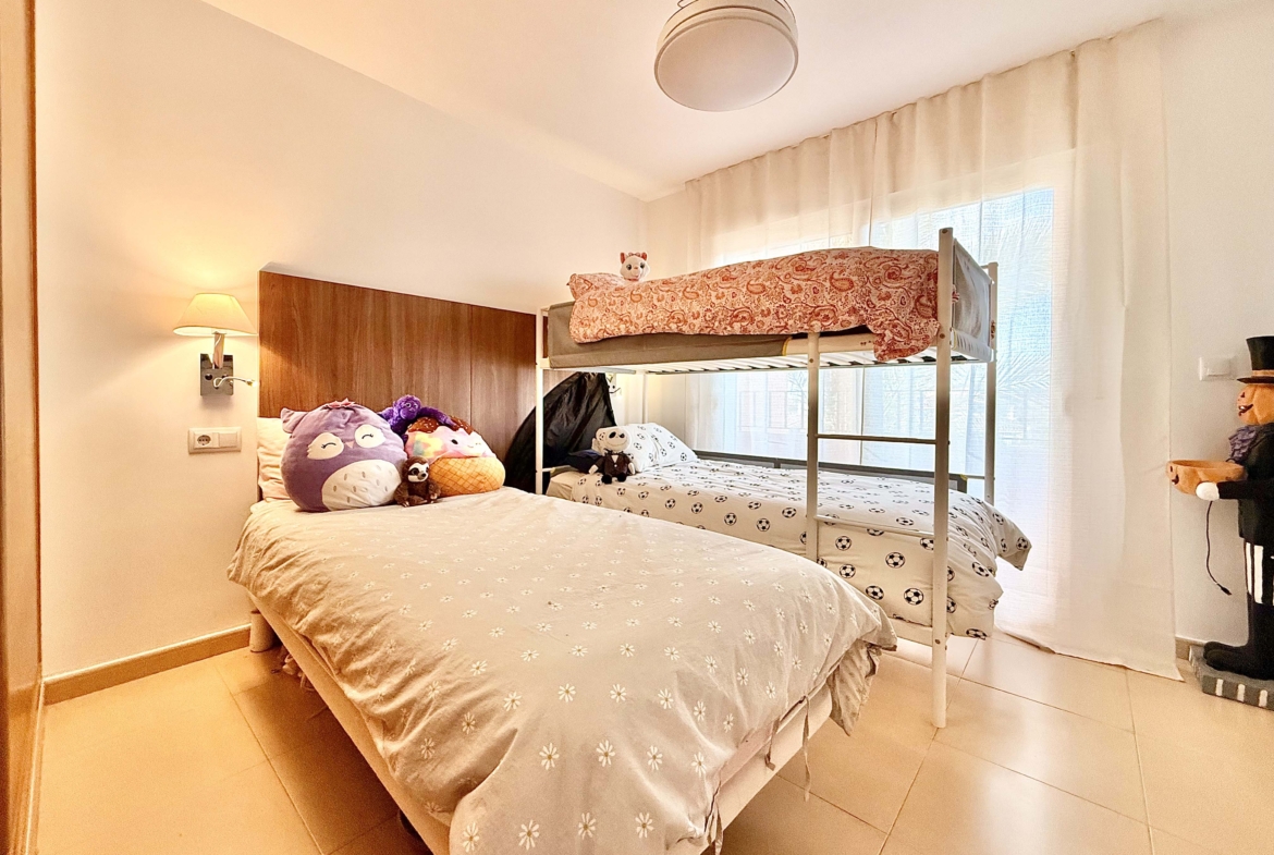 2-Bed Elegant Apartment second bedroom with private terrace and resort views at Mar Menor Golf Resort, Levante Properties listing.