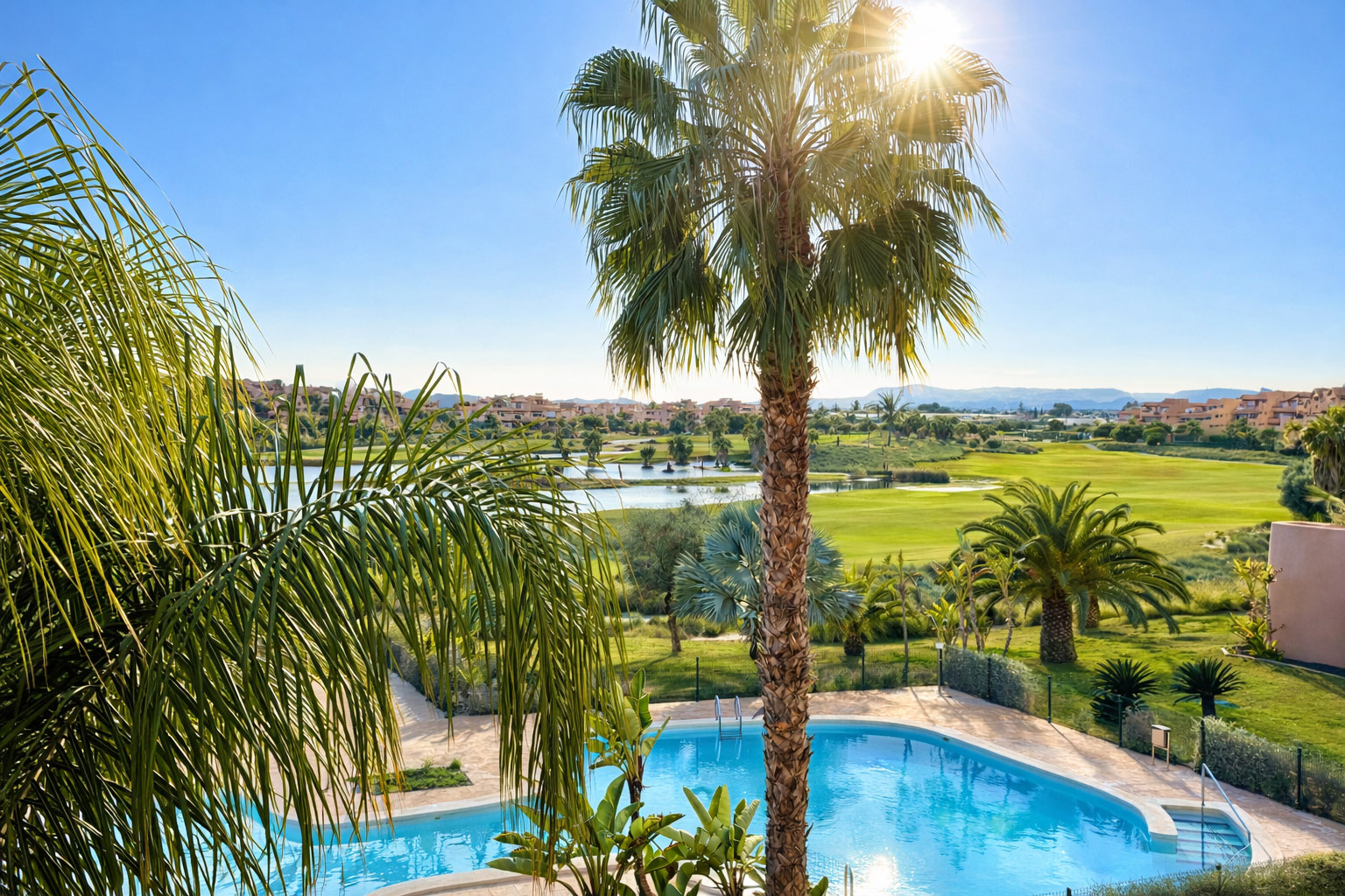 Communal pool and golf views from a 2-Bed South Facing Apartment at Mar Menor Golf Resort by Levante Properties