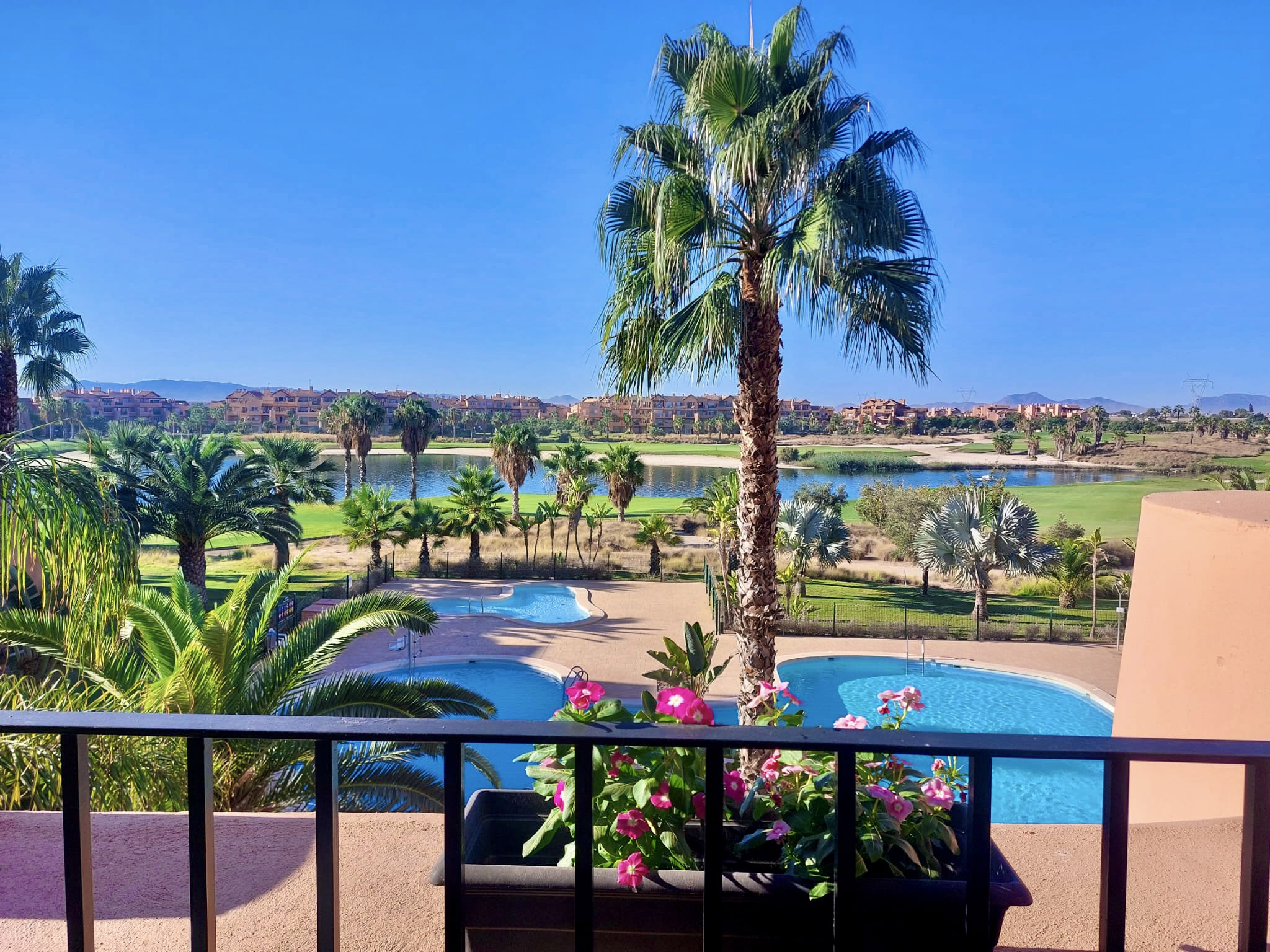 Communal pool and golf views from a 2-Bed South Facing Apartment at Mar Menor Golf Resort by Levante Properties