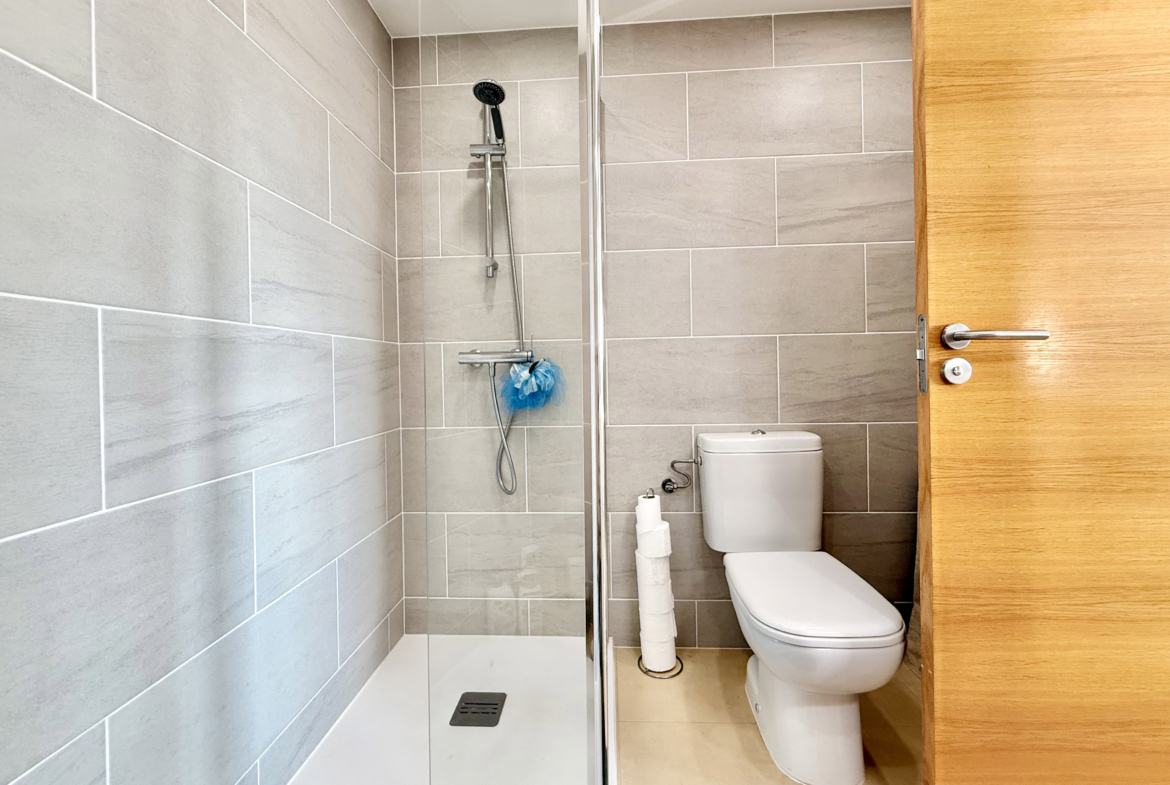 Modern en-suite bathroom with walk-in shower at Mar Menor Golf Resort apartment by Levante Properties