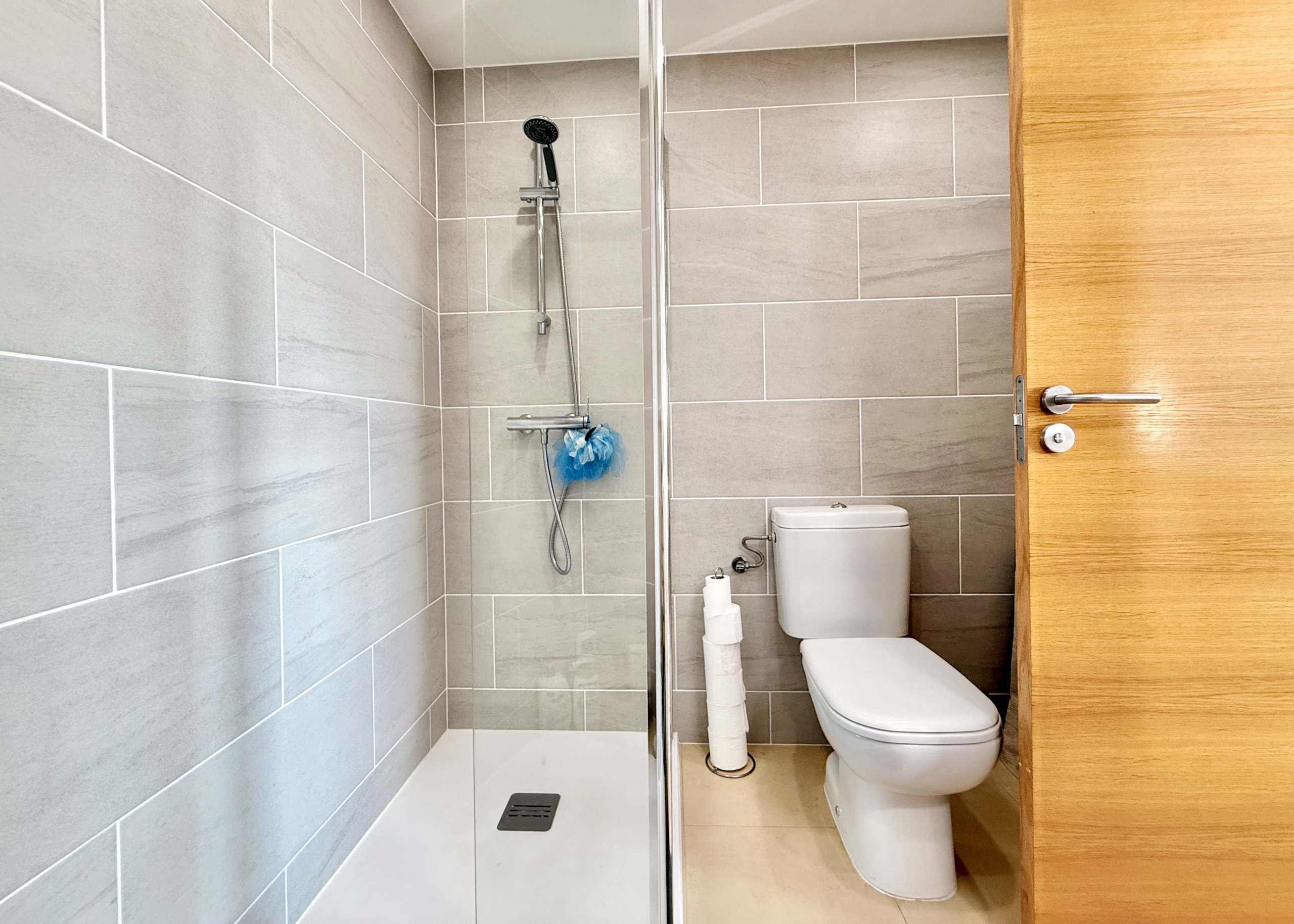 Modern en-suite bathroom with walk-in shower at Mar Menor Golf Resort apartment by Levante Properties