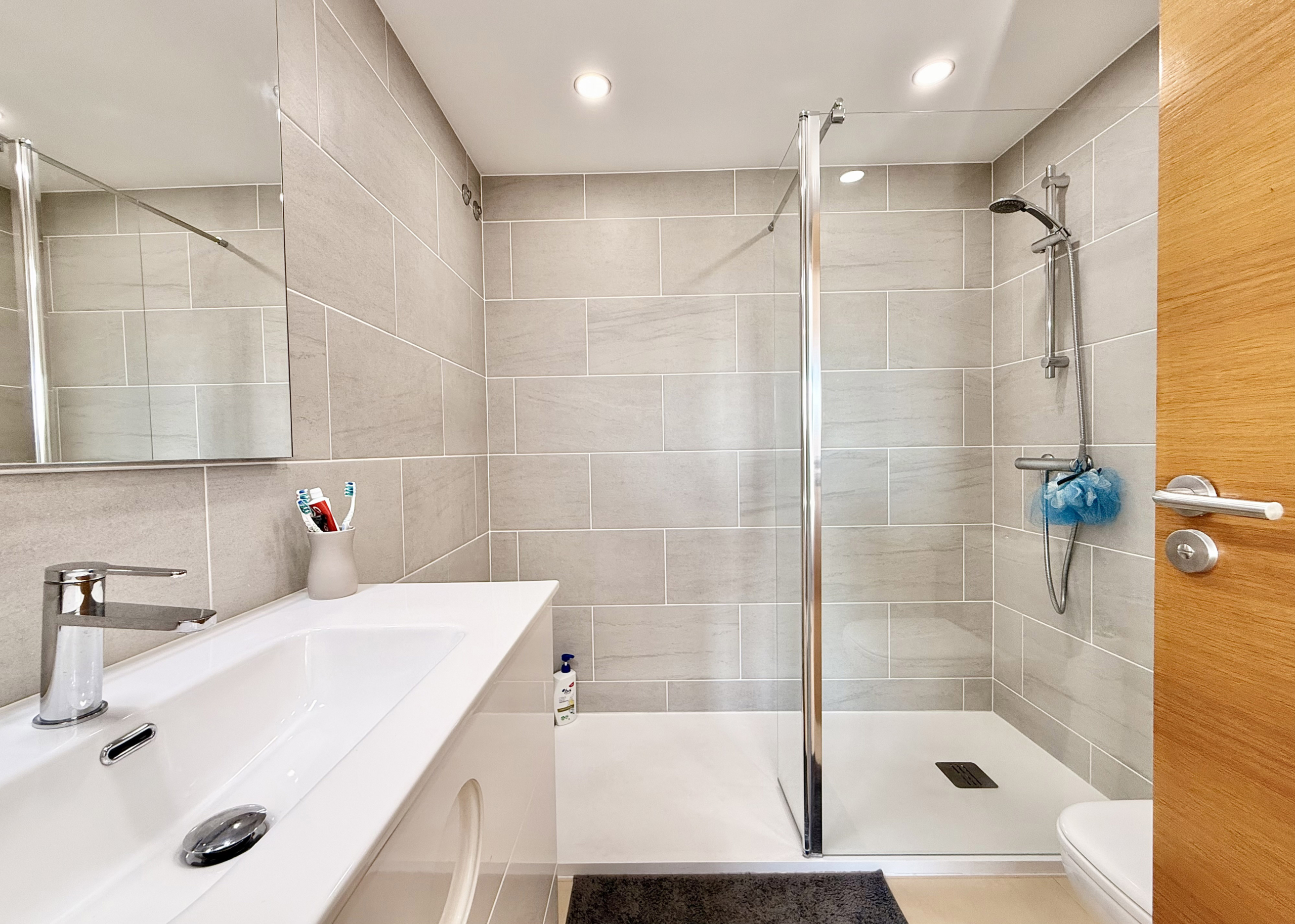 Modern en-suite bathroom with walk-in shower at Mar Menor Golf Resort apartment by Levante Properties