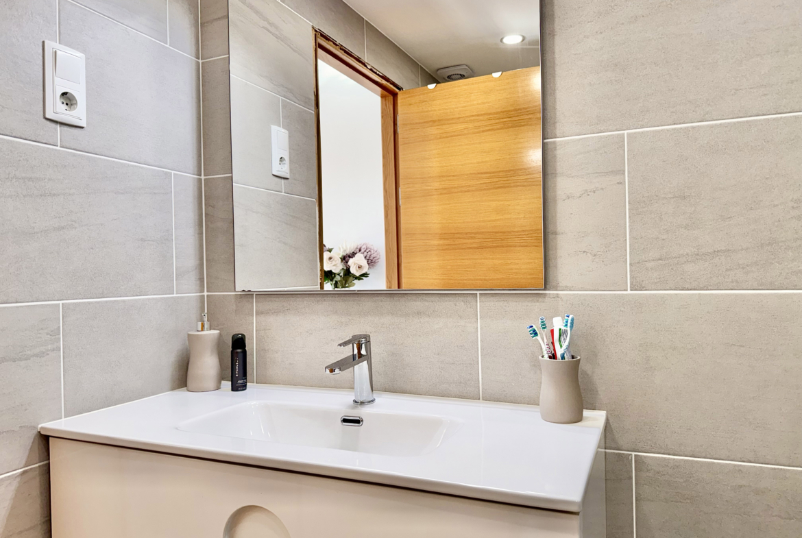 Modern en-suite bathroom with walk-in shower at Mar Menor Golf Resort apartment by Levante Properties