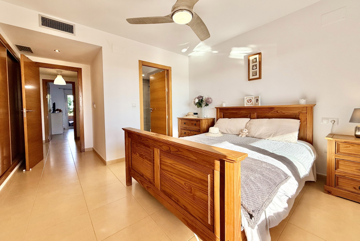 Master bedroom with terrace access at Mar Menor Golf Resort apartment by Levante Properties