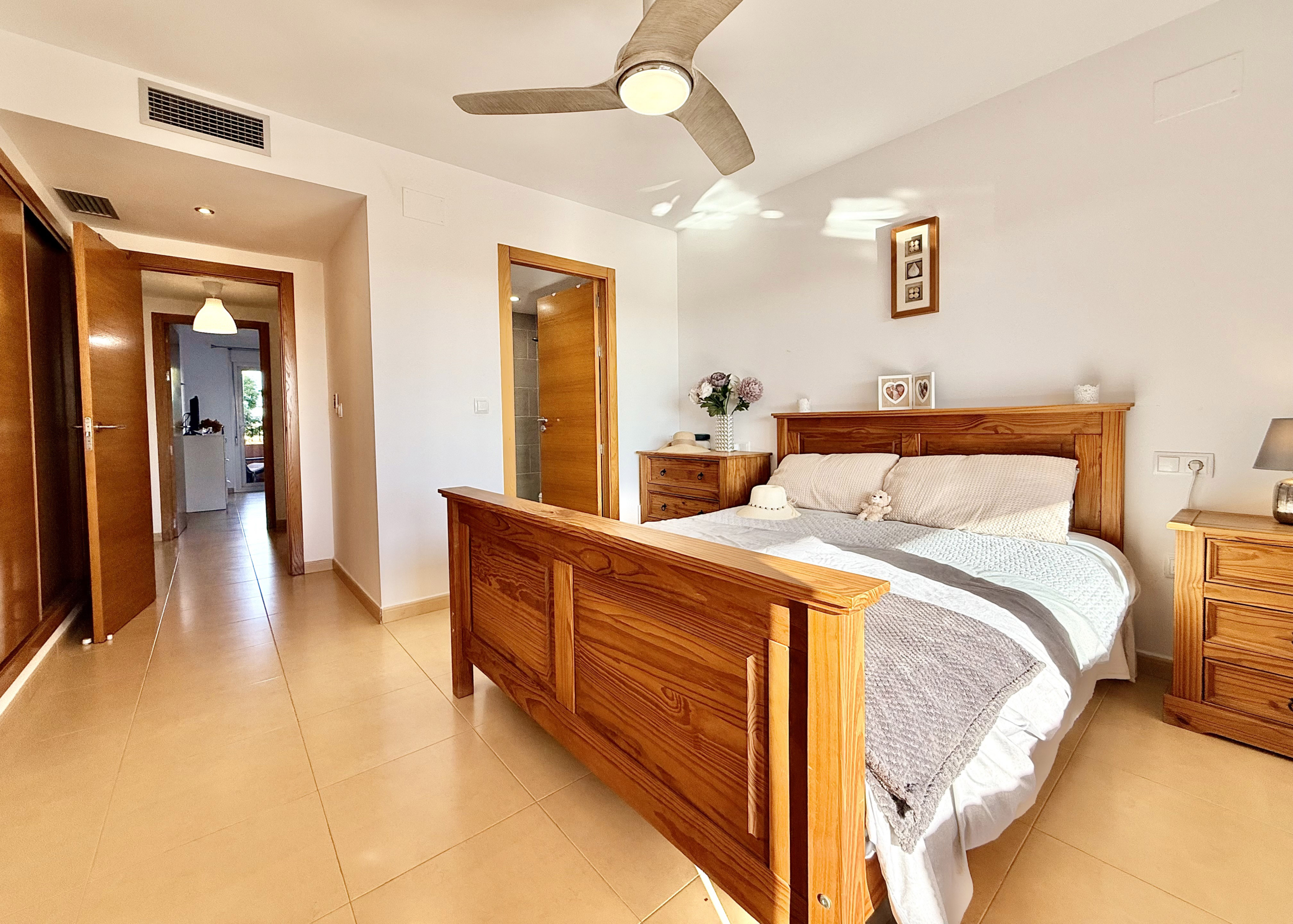 Master bedroom with terrace access at Mar Menor Golf Resort apartment by Levante Properties