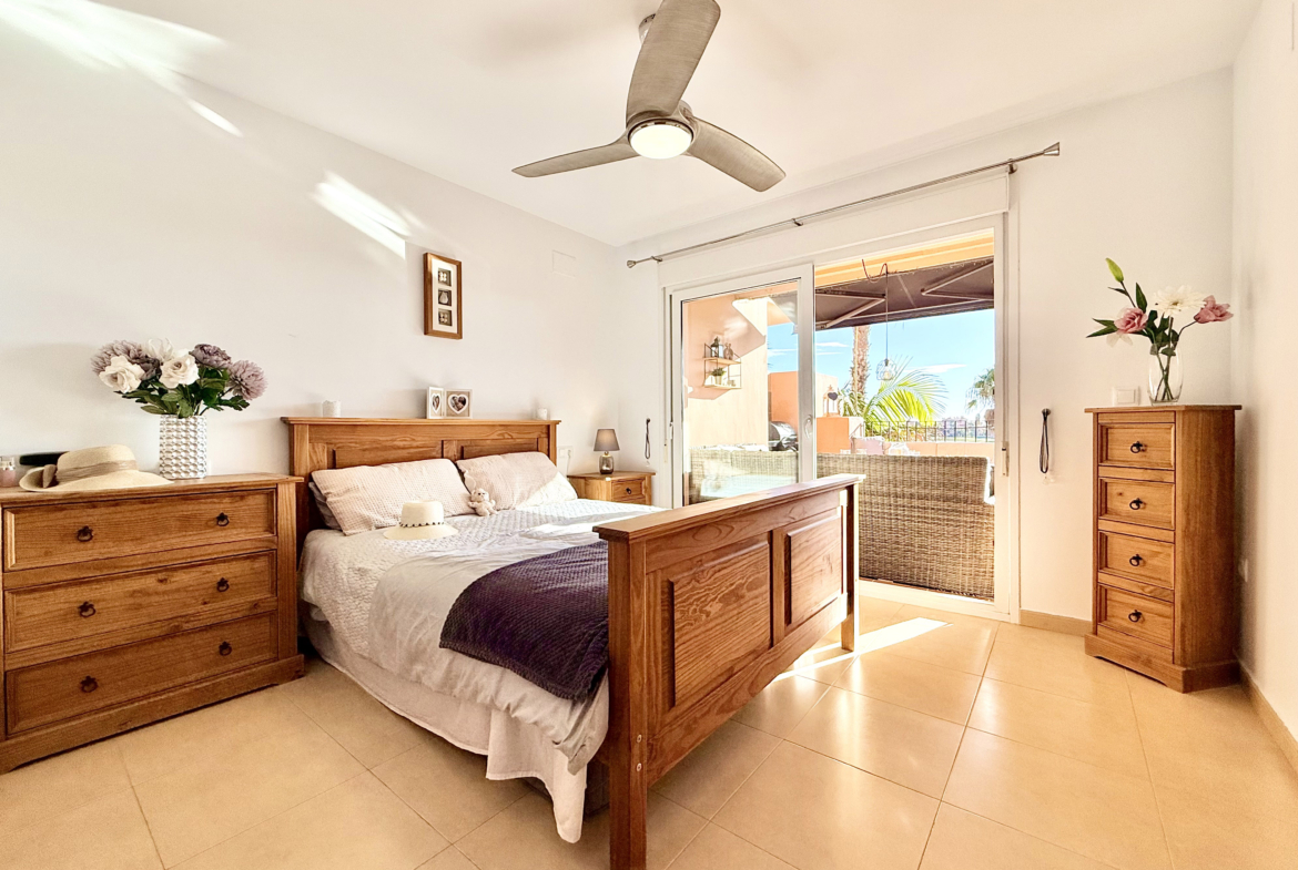 Master bedroom with terrace access at Mar Menor Golf Resort apartment by Levante Properties