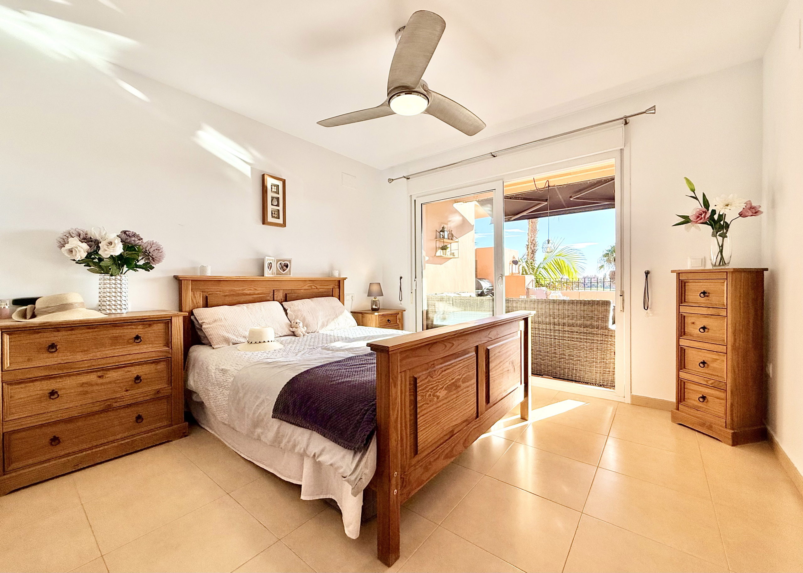 Master bedroom with terrace access at Mar Menor Golf Resort apartment by Levante Properties