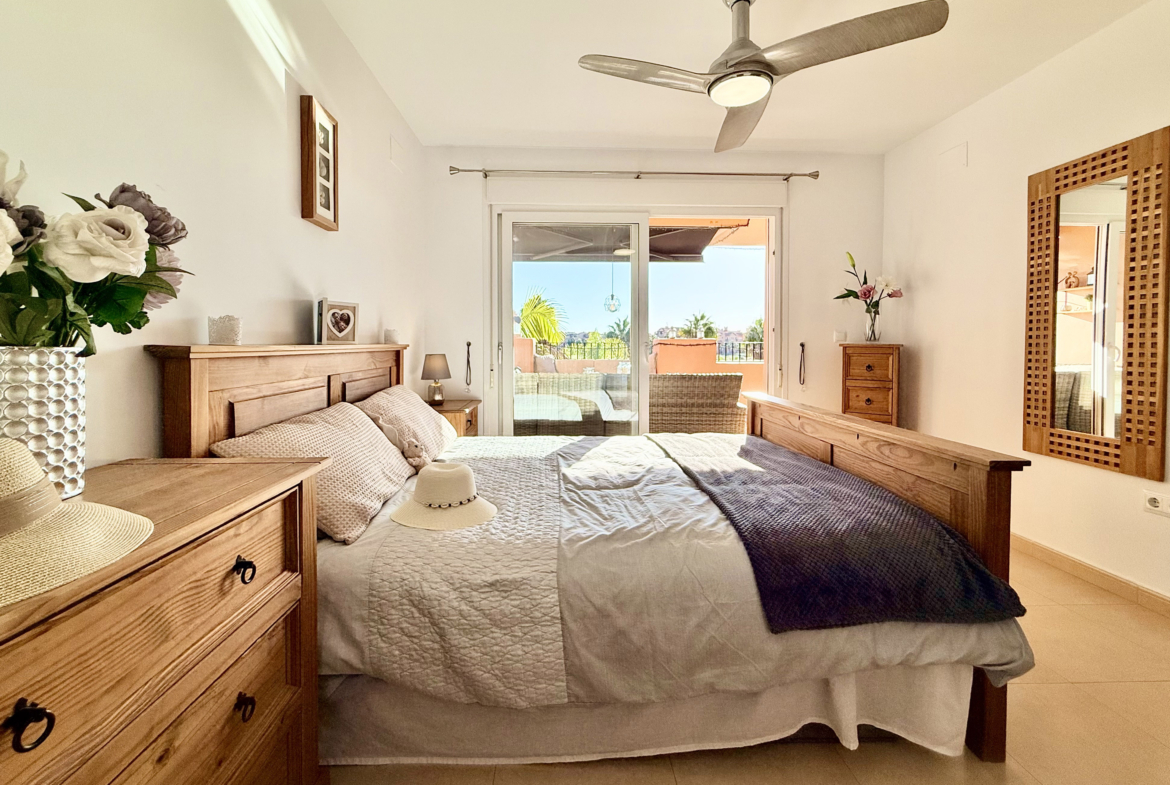 Master bedroom with terrace access at Mar Menor Golf Resort apartment by Levante Properties
