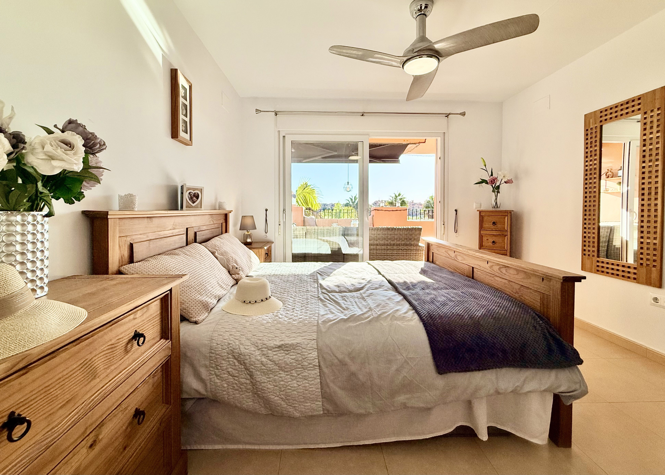 Master bedroom with terrace access at Mar Menor Golf Resort apartment by Levante Properties