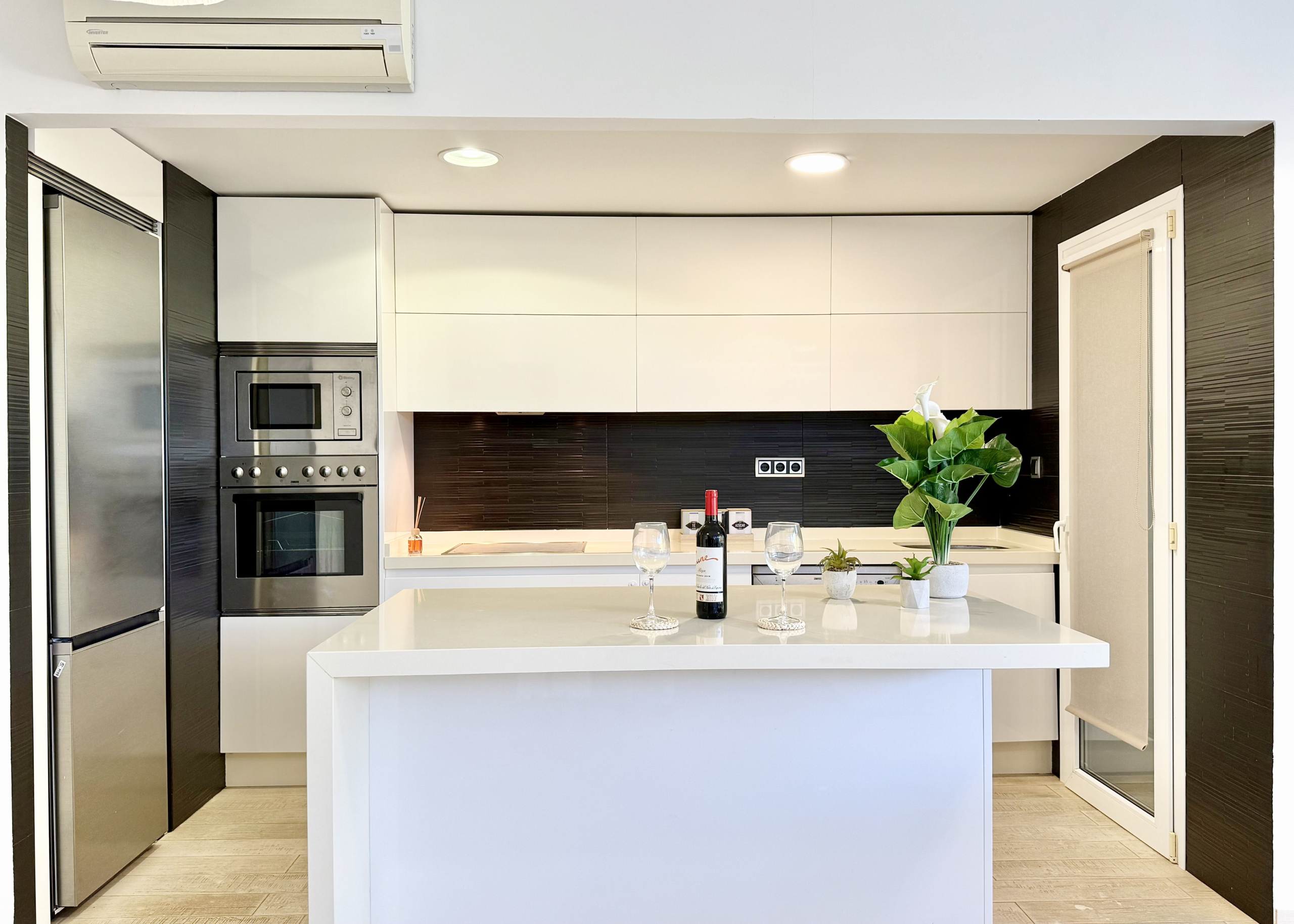Open-plan kitchen with island in exclusive 4 bed villa for sale on Mar Menor Golf Resort – Levante Properties