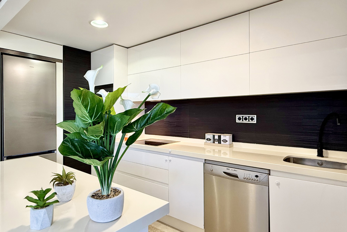 Open-plan kitchen with island in exclusive 4 bed villa for sale on Mar Menor Golf Resort – Levante Properties