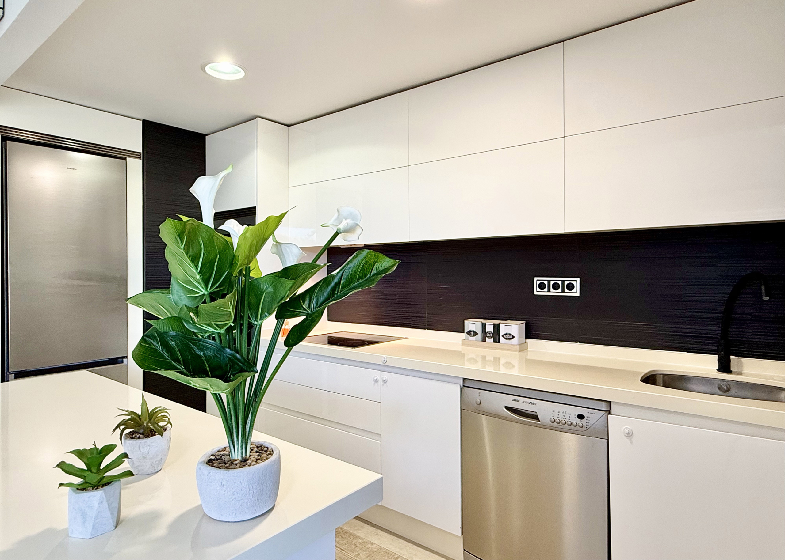 Open-plan kitchen with island in exclusive 4 bed villa for sale on Mar Menor Golf Resort – Levante Properties