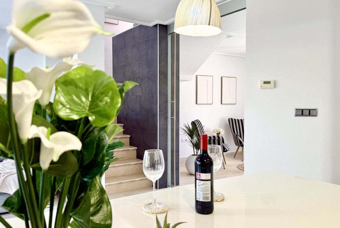 Open-plan kitchen with island in exclusive 4 bed villa for sale on Mar Menor Golf Resort – Levante Properties