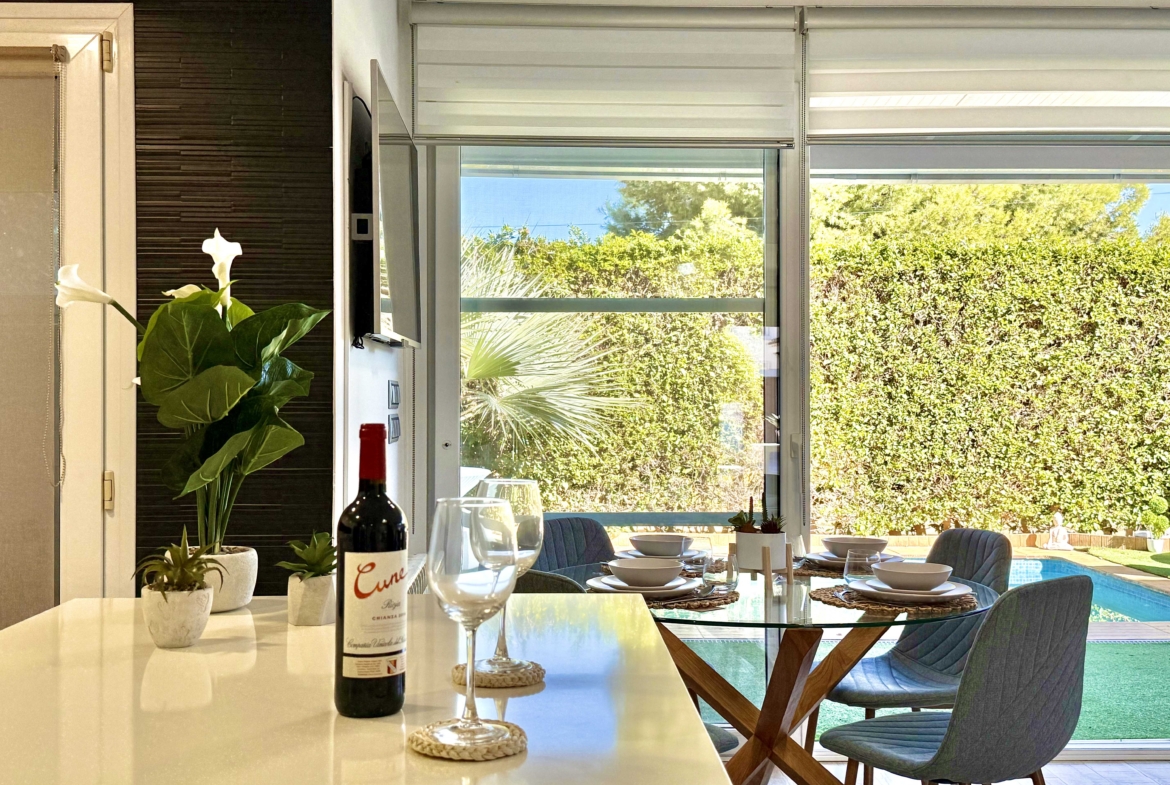 Open-plan kitchen with island in exclusive 4 bed villa for sale on Mar Menor Golf Resort – Levante Properties