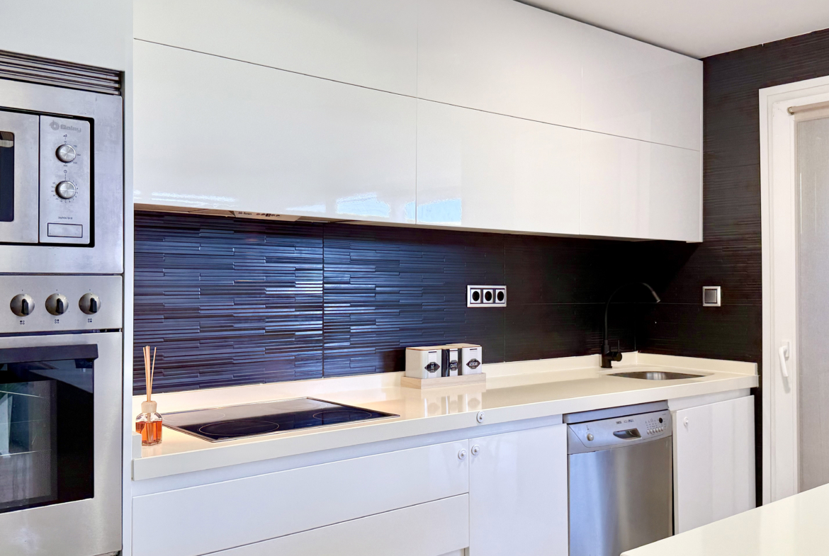 Open-plan kitchen with island in exclusive 4 bed villa for sale on Mar Menor Golf Resort – Levante Properties