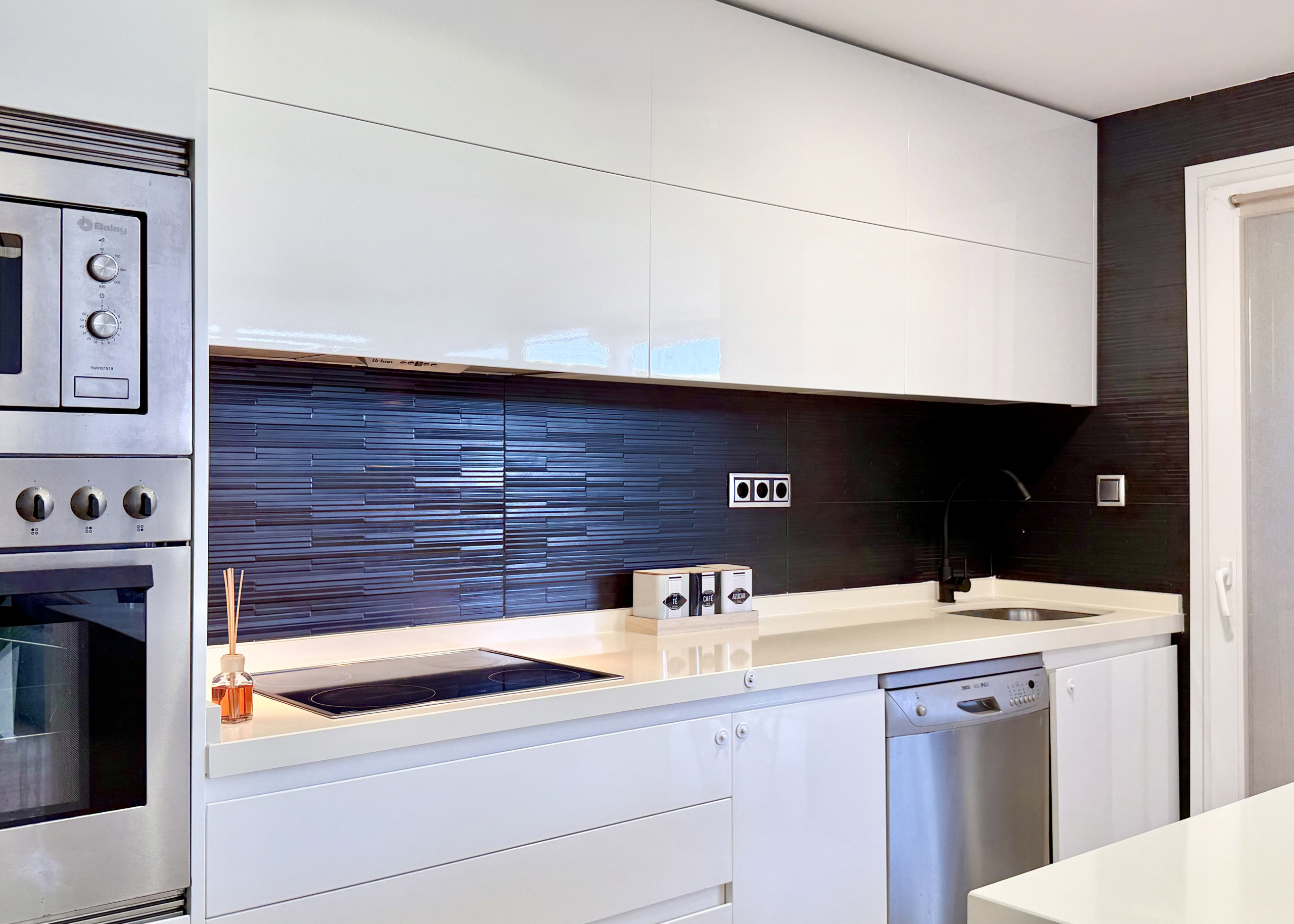 Open-plan kitchen with island in exclusive 4 bed villa for sale on Mar Menor Golf Resort – Levante Properties