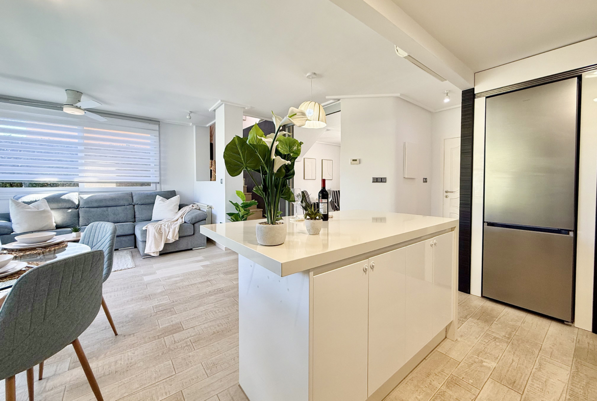 Open-plan kitchen with island in exclusive 4 bed villa for sale on Mar Menor Golf Resort – Levante Properties