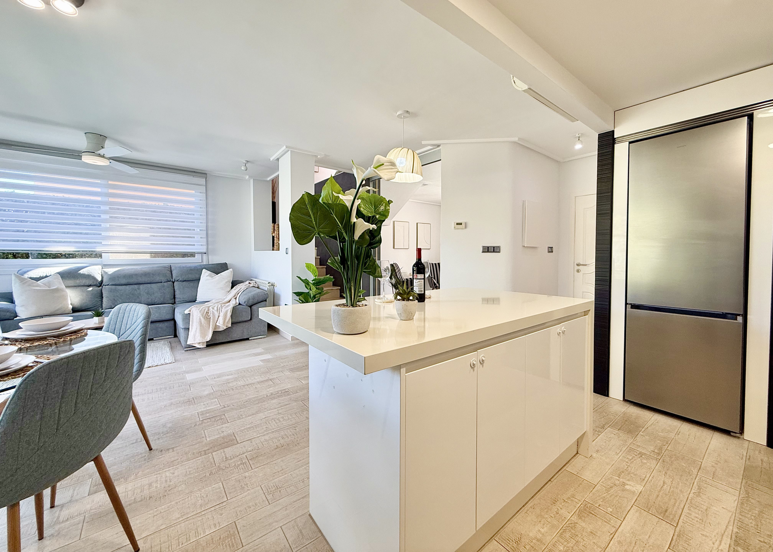 Open-plan kitchen with island in exclusive 4 bed villa for sale on Mar Menor Golf Resort – Levante Properties