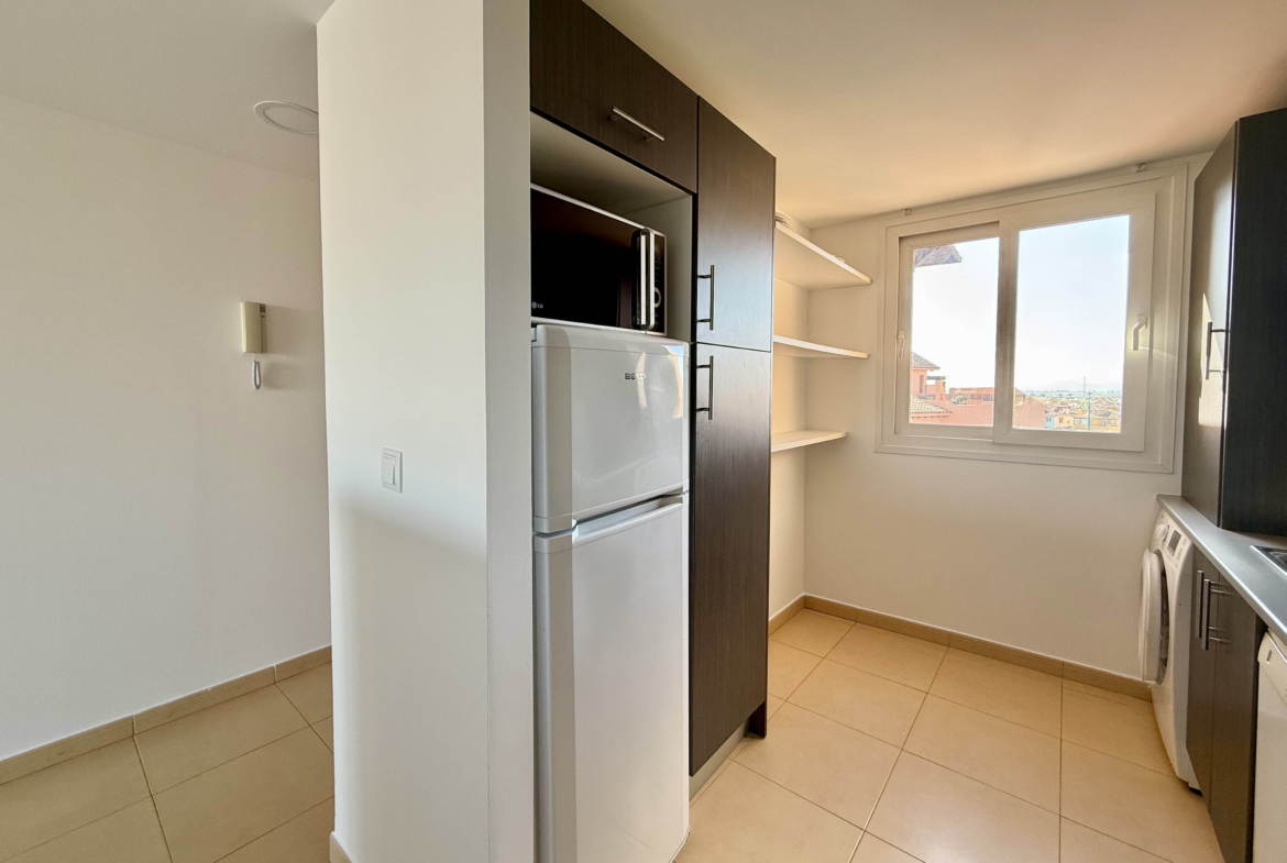 Fully fitted kitchen in two bedroom penthouse at Mar Menor Golf Resort by Levante Properties