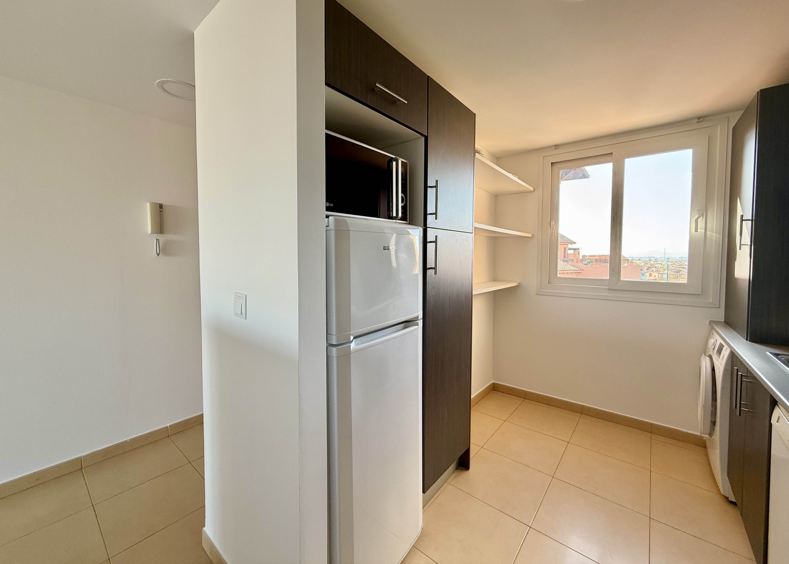Fully fitted kitchen in two bedroom penthouse at Mar Menor Golf Resort by Levante Properties