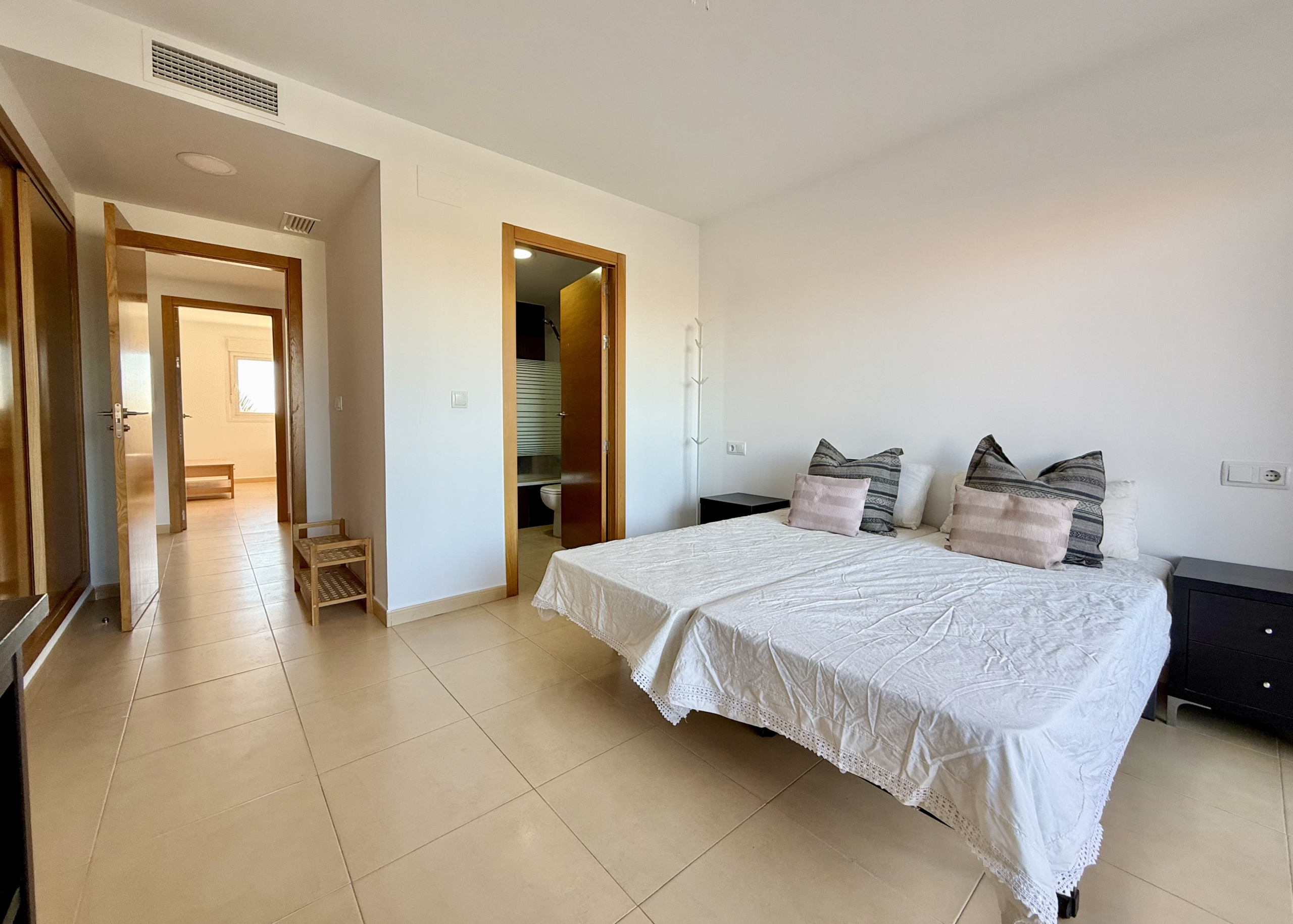 Master bedroom with terrace access in penthouse at Mar Menor Golf Resort Levante Properties