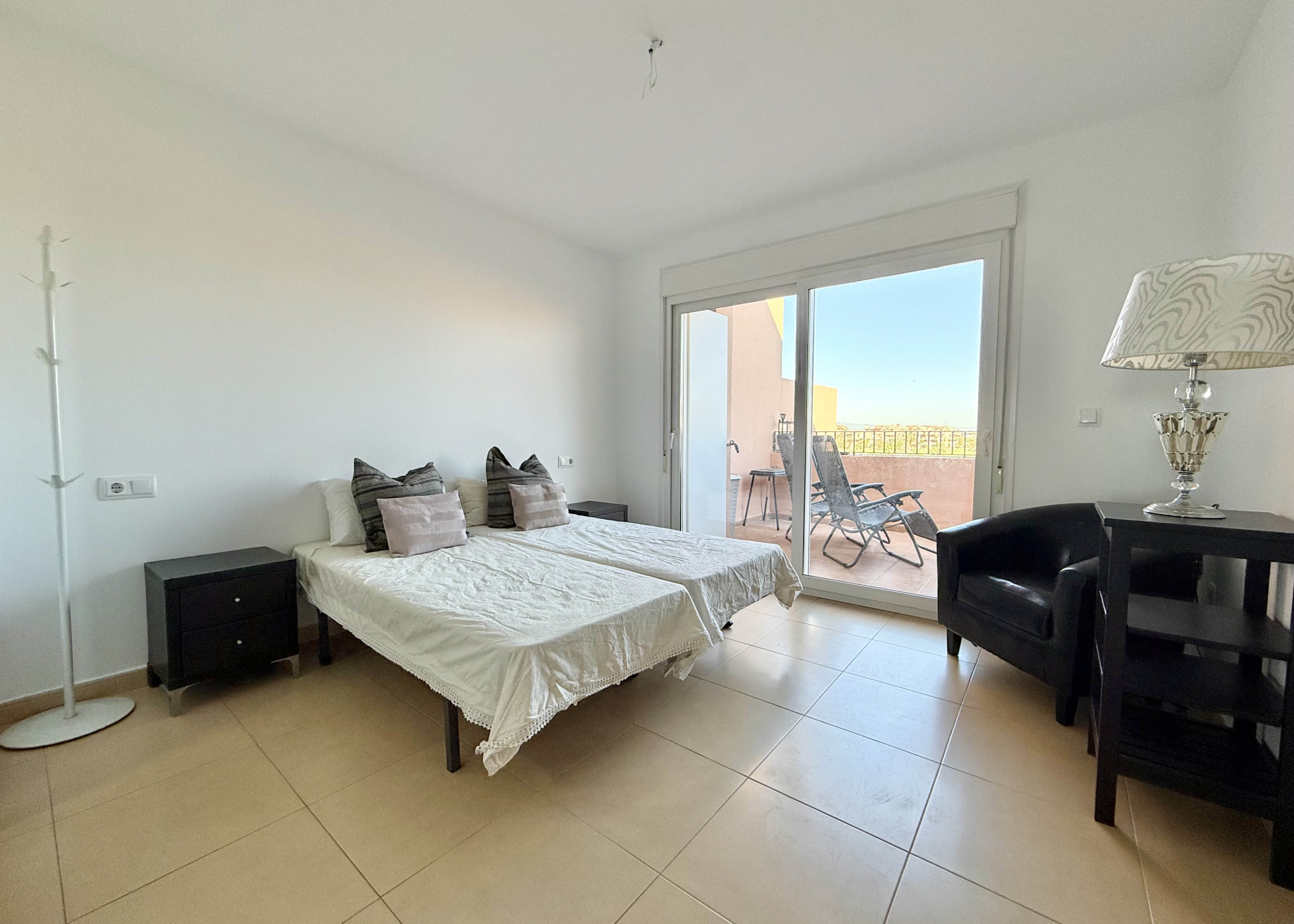 Master bedroom with terrace access in penthouse at Mar Menor Golf Resort Levante Properties