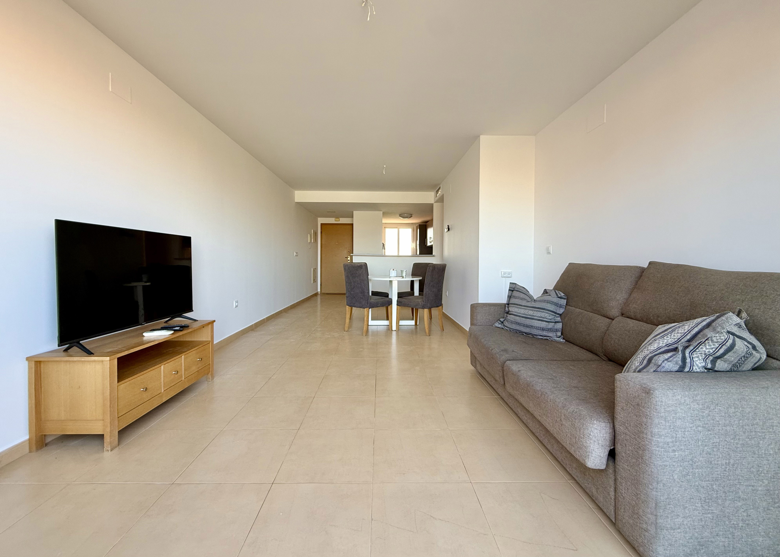 Bright open-plan living room in penthouse at Mar Menor Golf Resort by Levante Properties