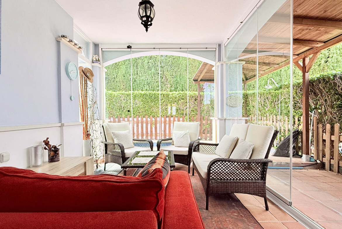 Garden patio with glass curtains at Ciervo villa in Mar Menor Golf Resort by Levante Properties
