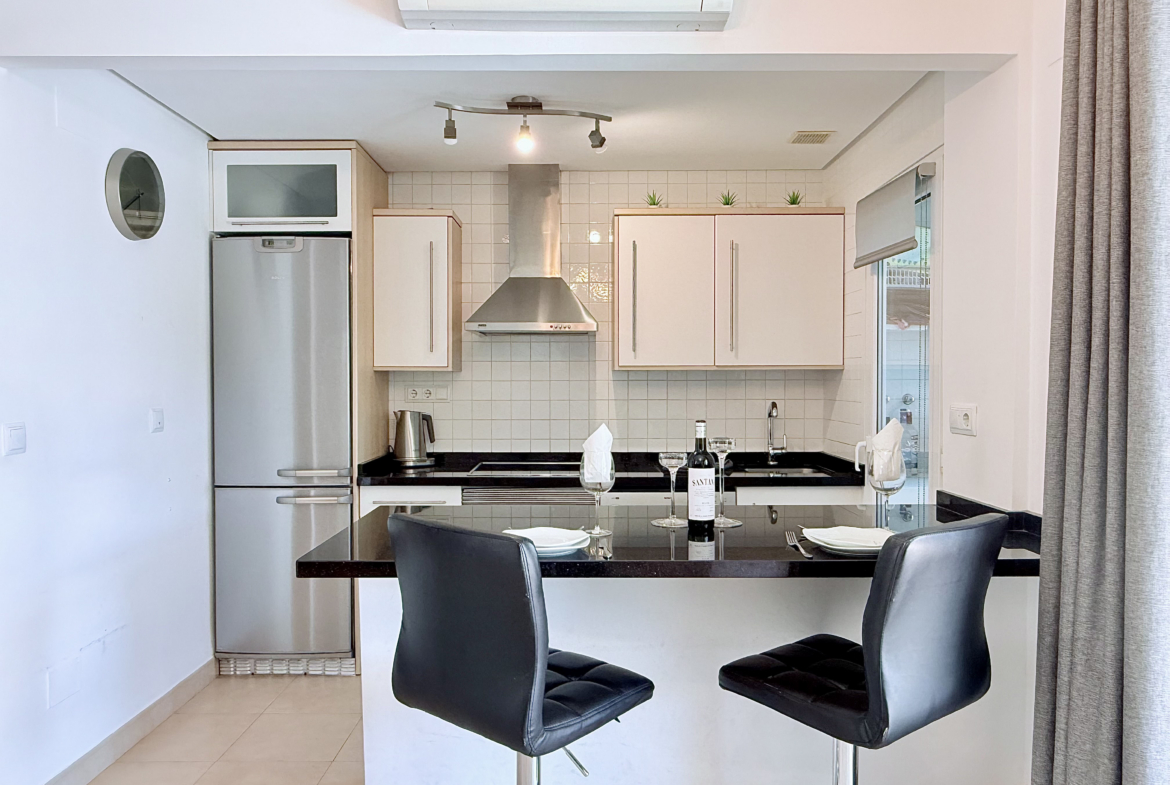 Open plan kitchen and dining area in Isla Grosa villa on Mar Menor Golf Resort by Levante Properties