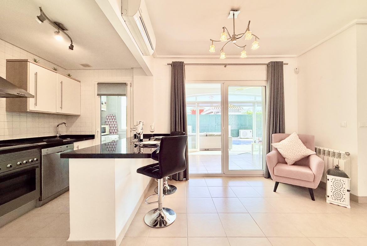 Open plan kitchen and dining area in Isla Grosa villa on Mar Menor Golf Resort by Levante Properties