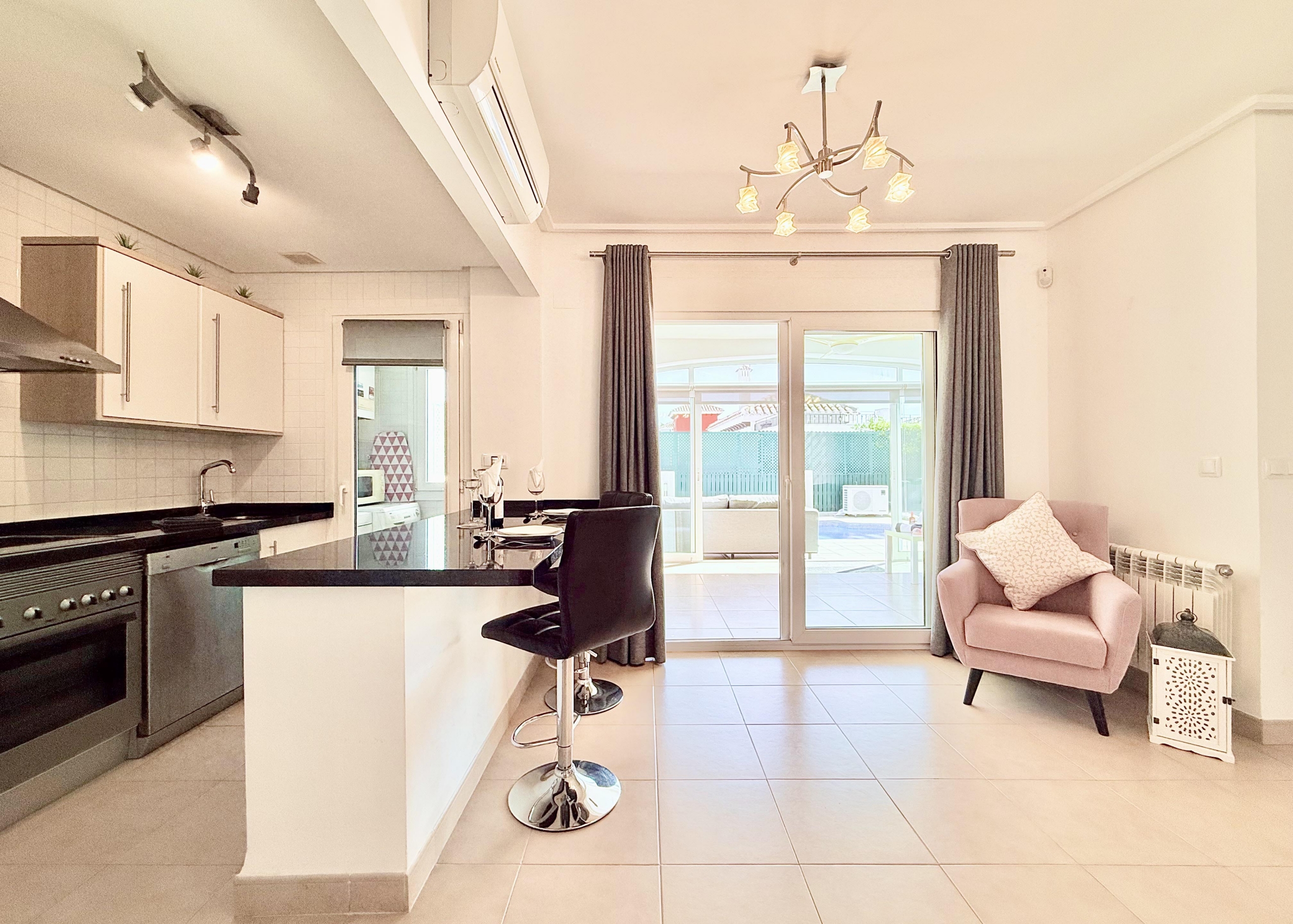 Open plan kitchen and dining area in Isla Grosa villa on Mar Menor Golf Resort by Levante Properties