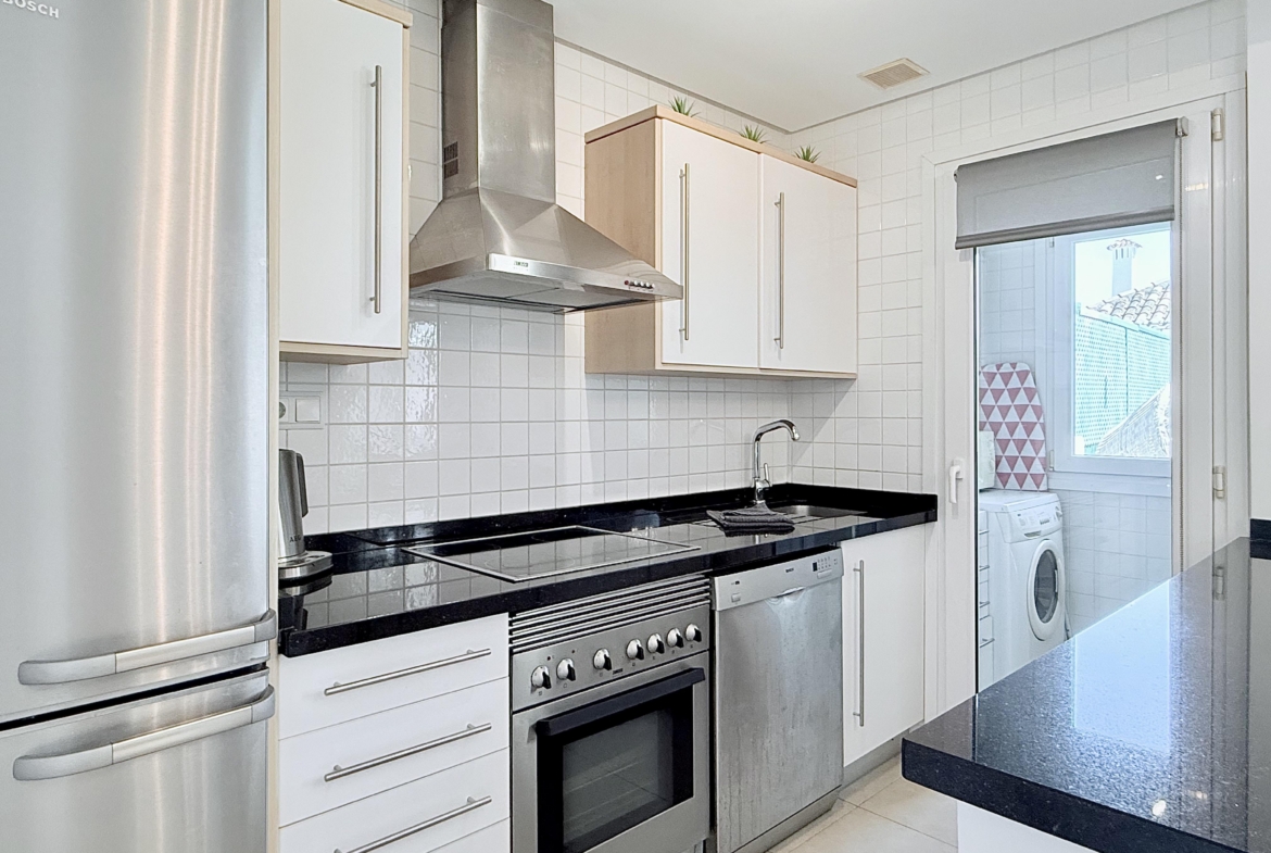 Open plan kitchen and dining area in Isla Grosa villa on Mar Menor Golf Resort by Levante Properties