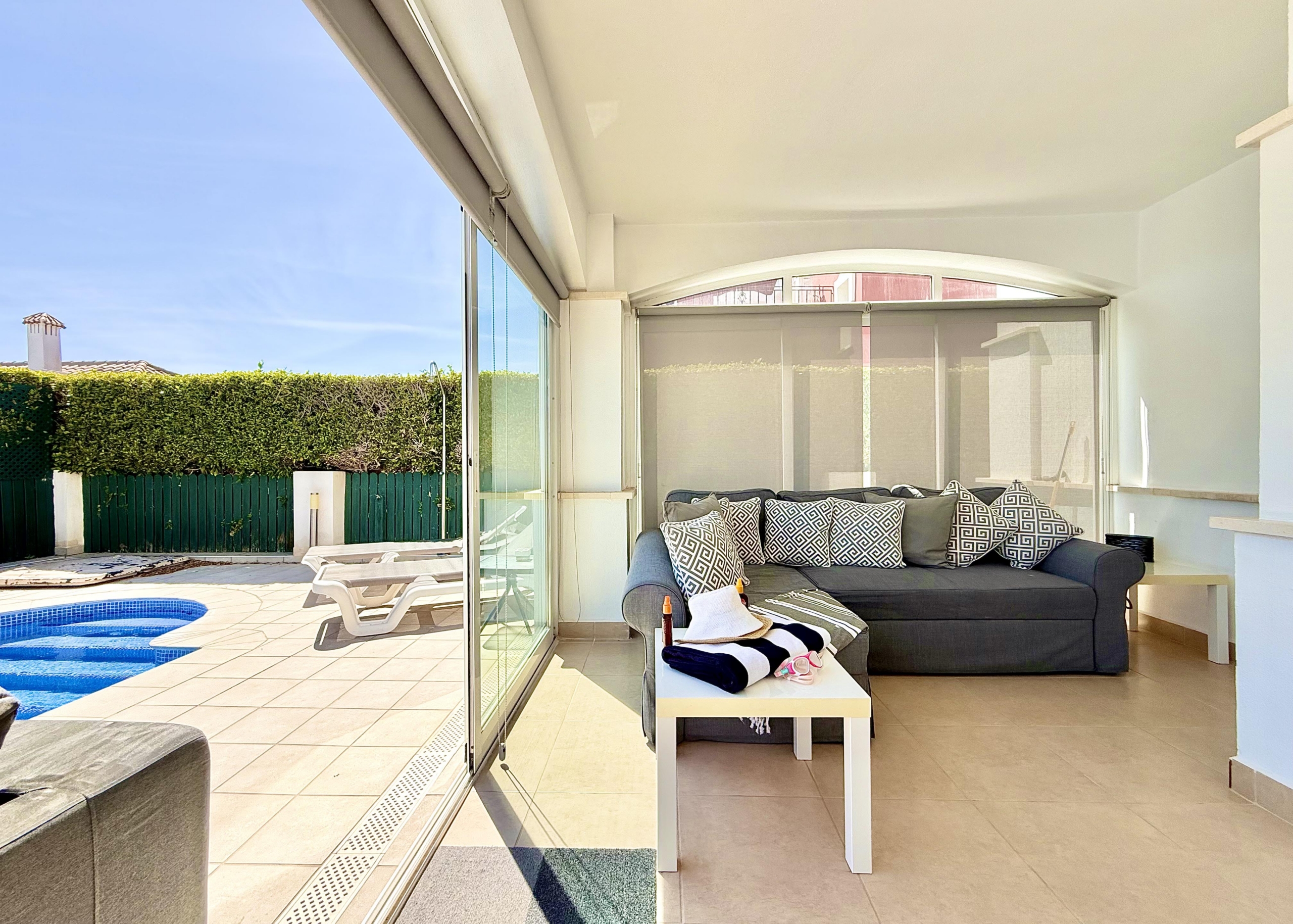Enclosed terrace and sun lounge at Isla Grosa villa on Mar Menor Golf Resort
