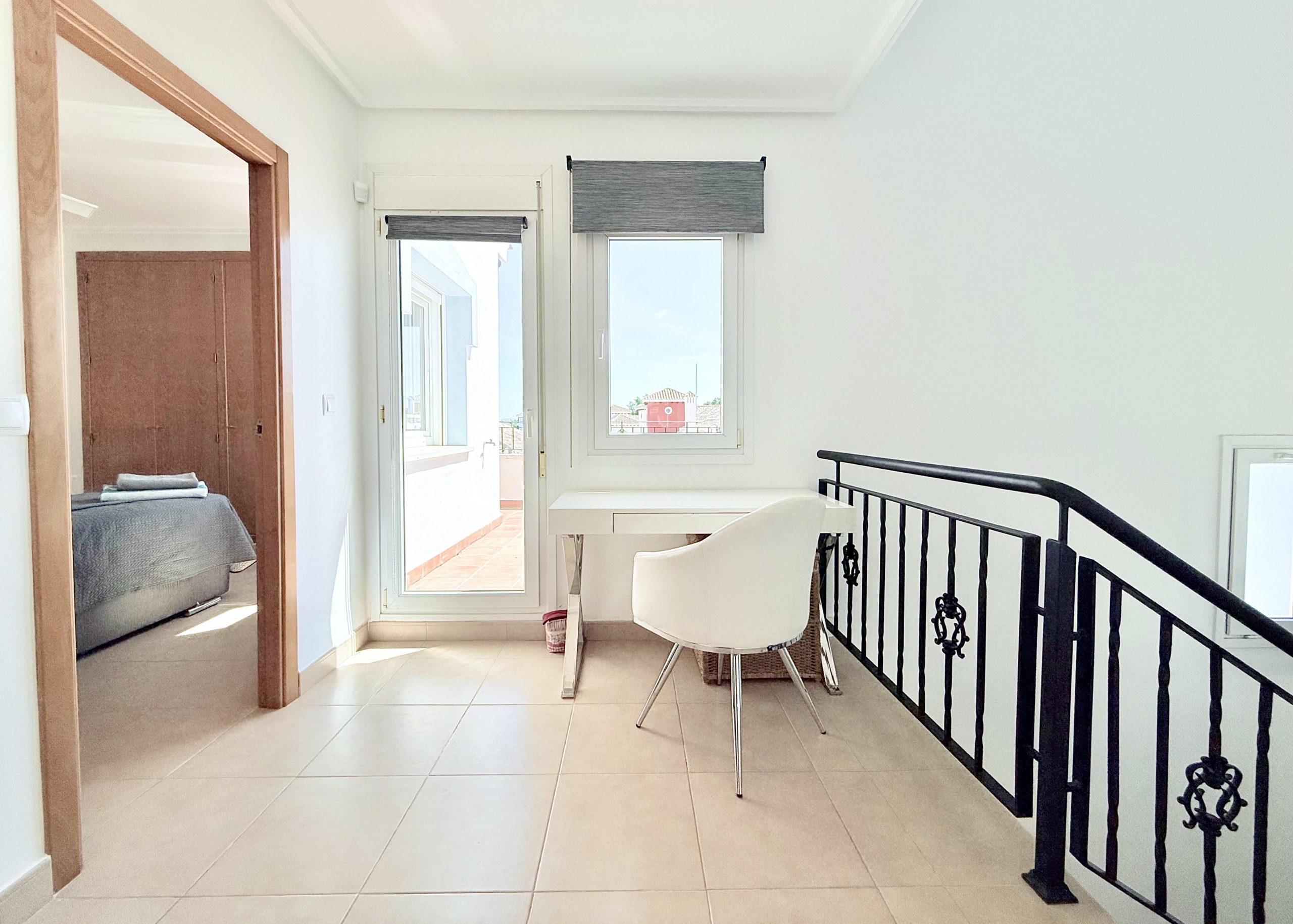 Bright first floor landing with terrace access in Isla Grosa villa on Mar Menor Golf Resort