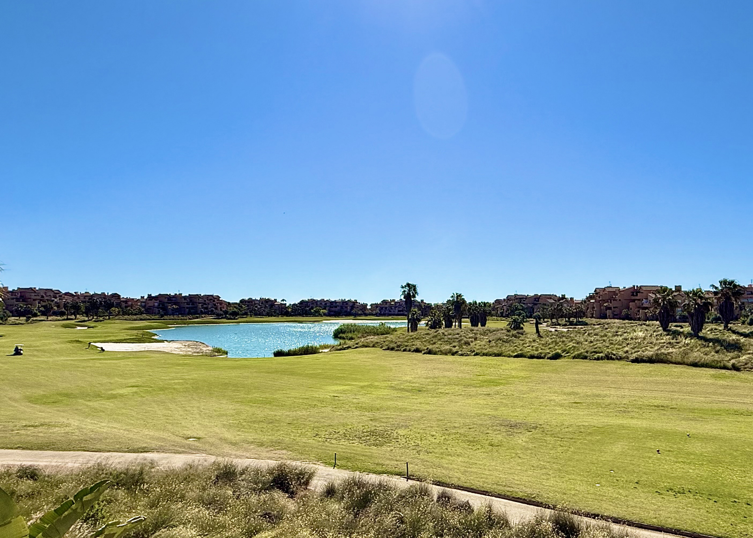 Panoramic golf and lake views from south-facing apartment on Mar Menor Golf Resort