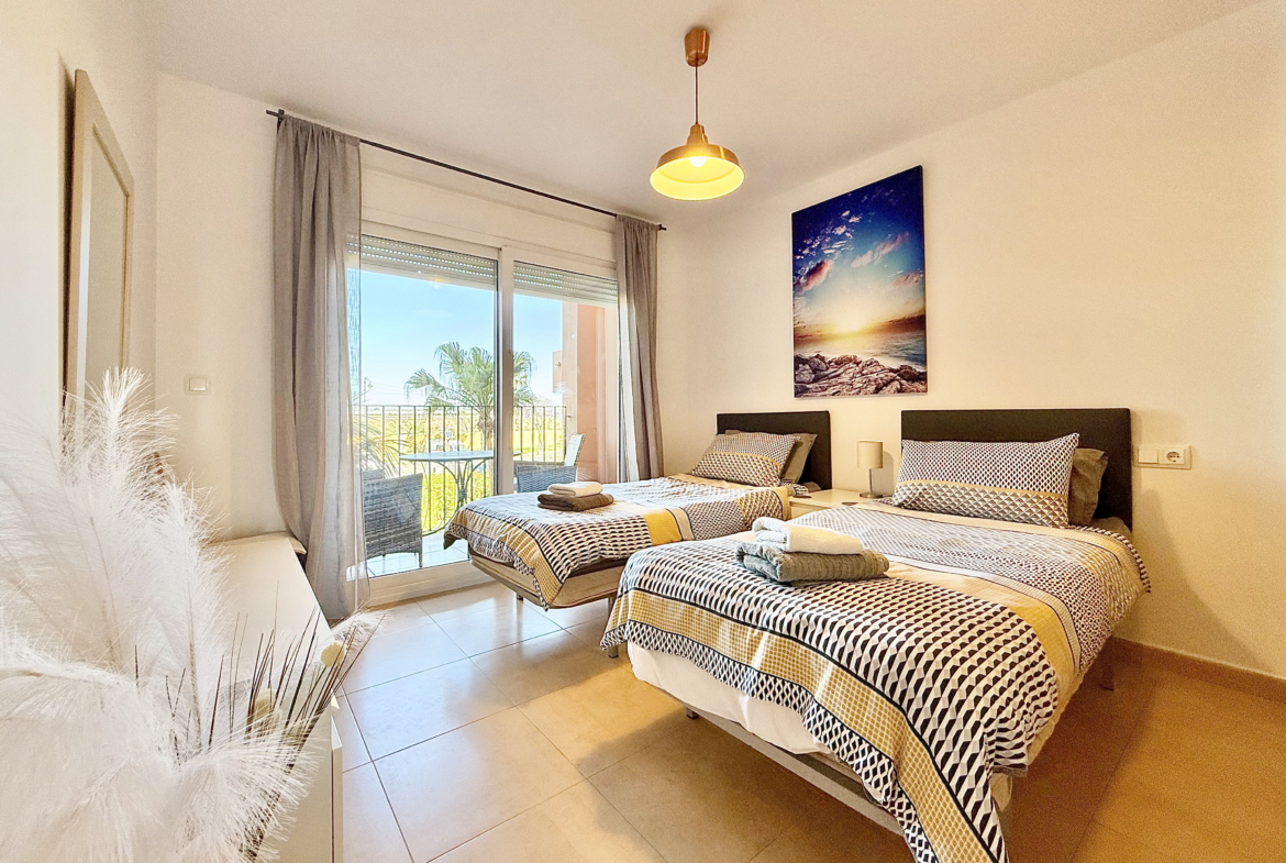 Guest bedroom with private terrace in Mar Menor Golf Resort apartment