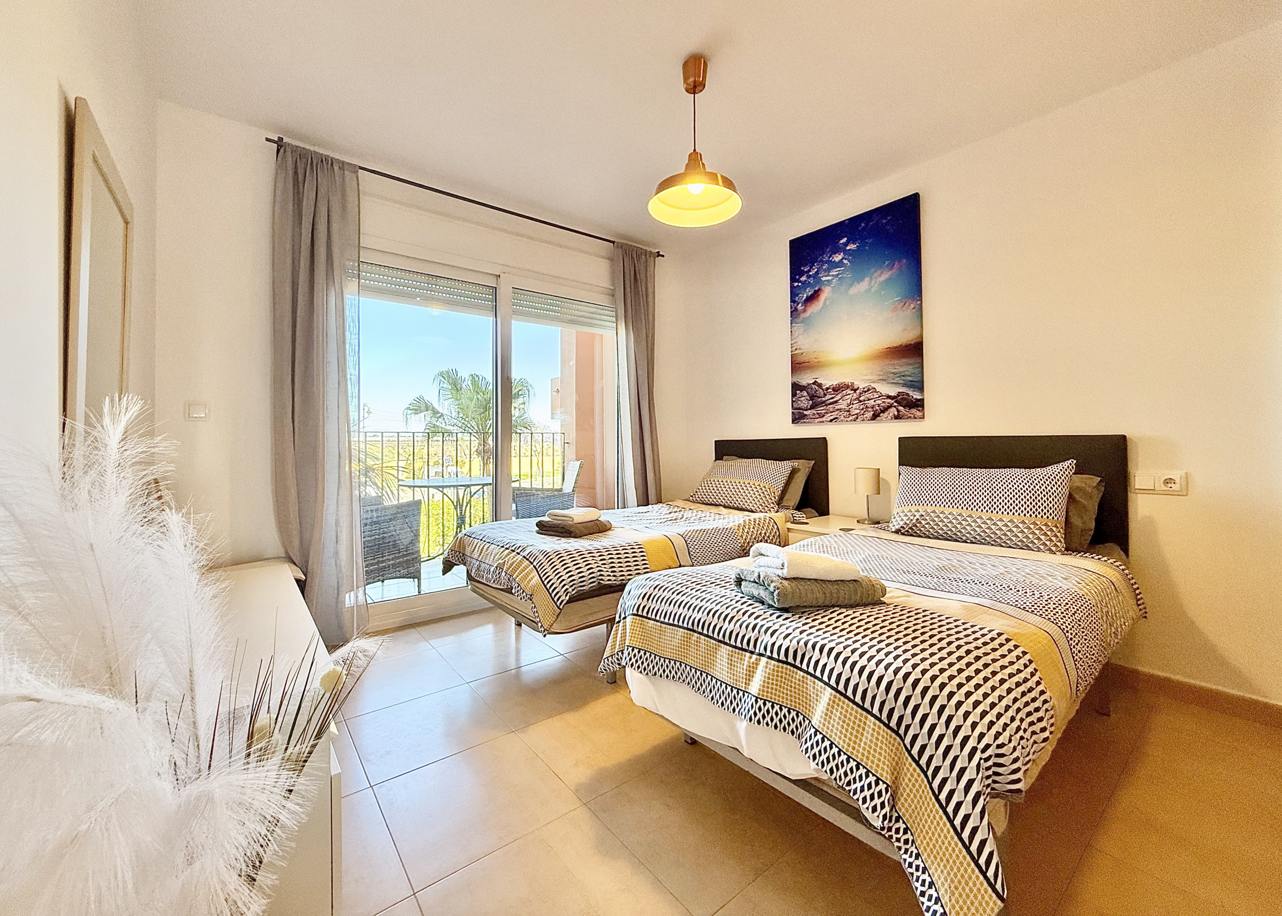 Guest bedroom with private terrace in Mar Menor Golf Resort apartment