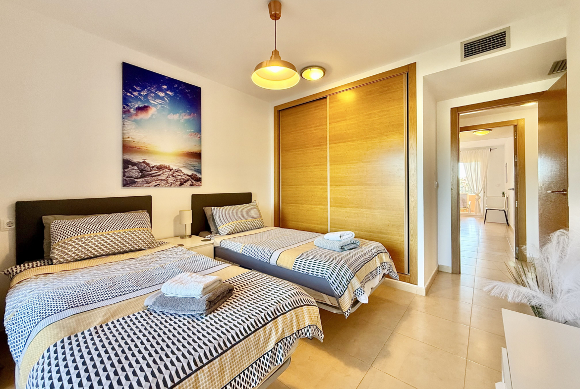 Guest bedroom with private terrace in Mar Menor Golf Resort apartment