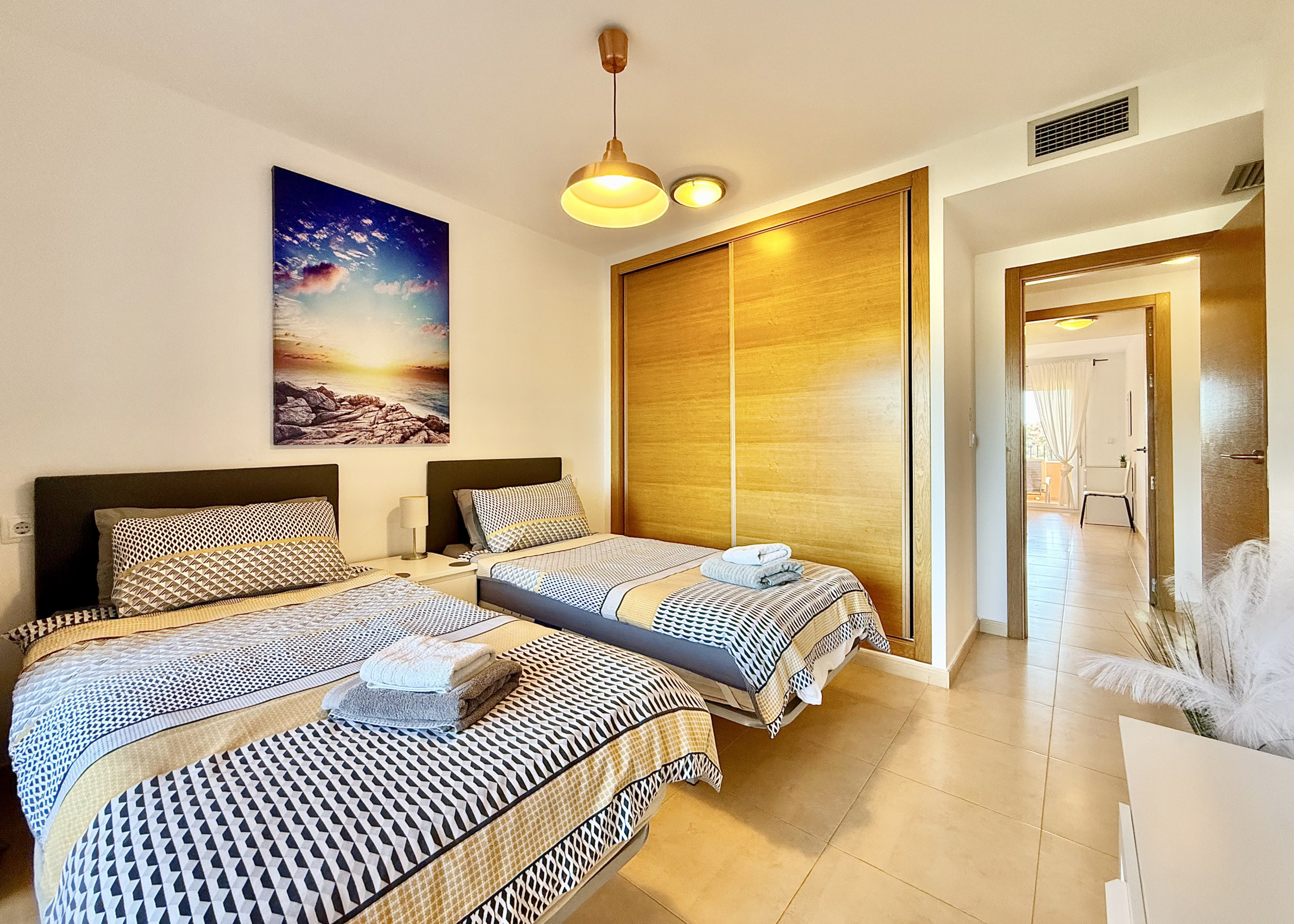 Guest bedroom with private terrace in Mar Menor Golf Resort apartment