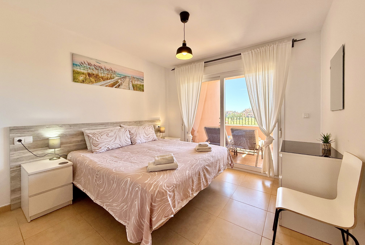 Master bedroom with terrace access in Mar Menor Golf Resort apartment for sale