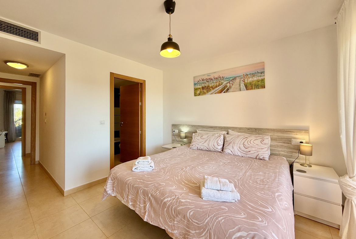 Master bedroom with terrace access in Mar Menor Golf Resort apartment for sale
