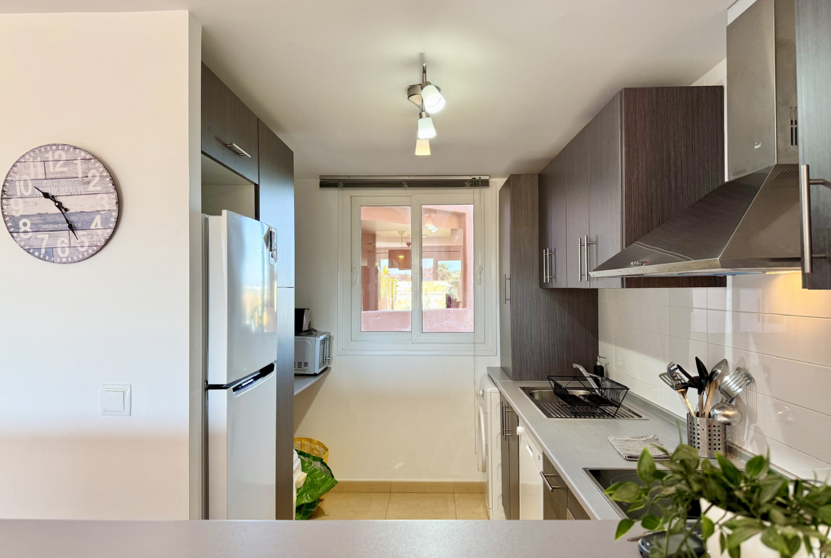 Modern kitchen in south-facing apartment on Mar Menor Golf Resort by Levante Properties