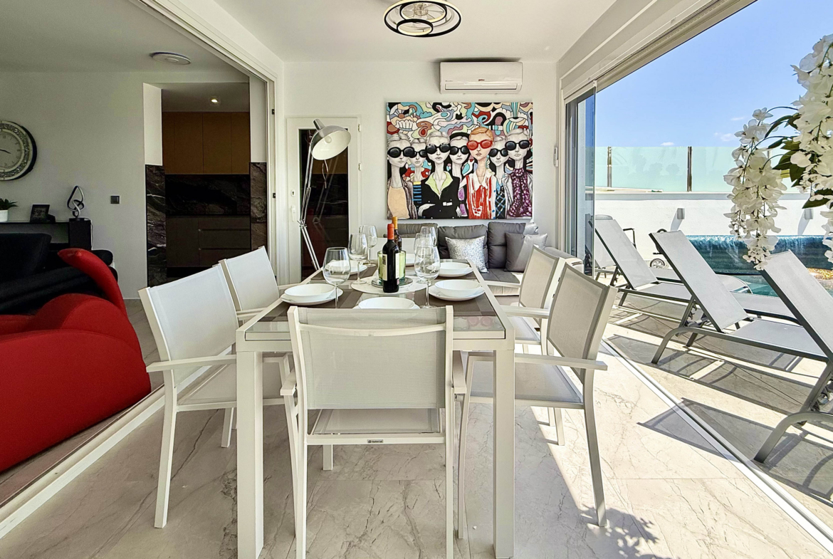 Modern dining area in exclusive villa at Mar Menor Golf Resort marketed by Cristina Lopez