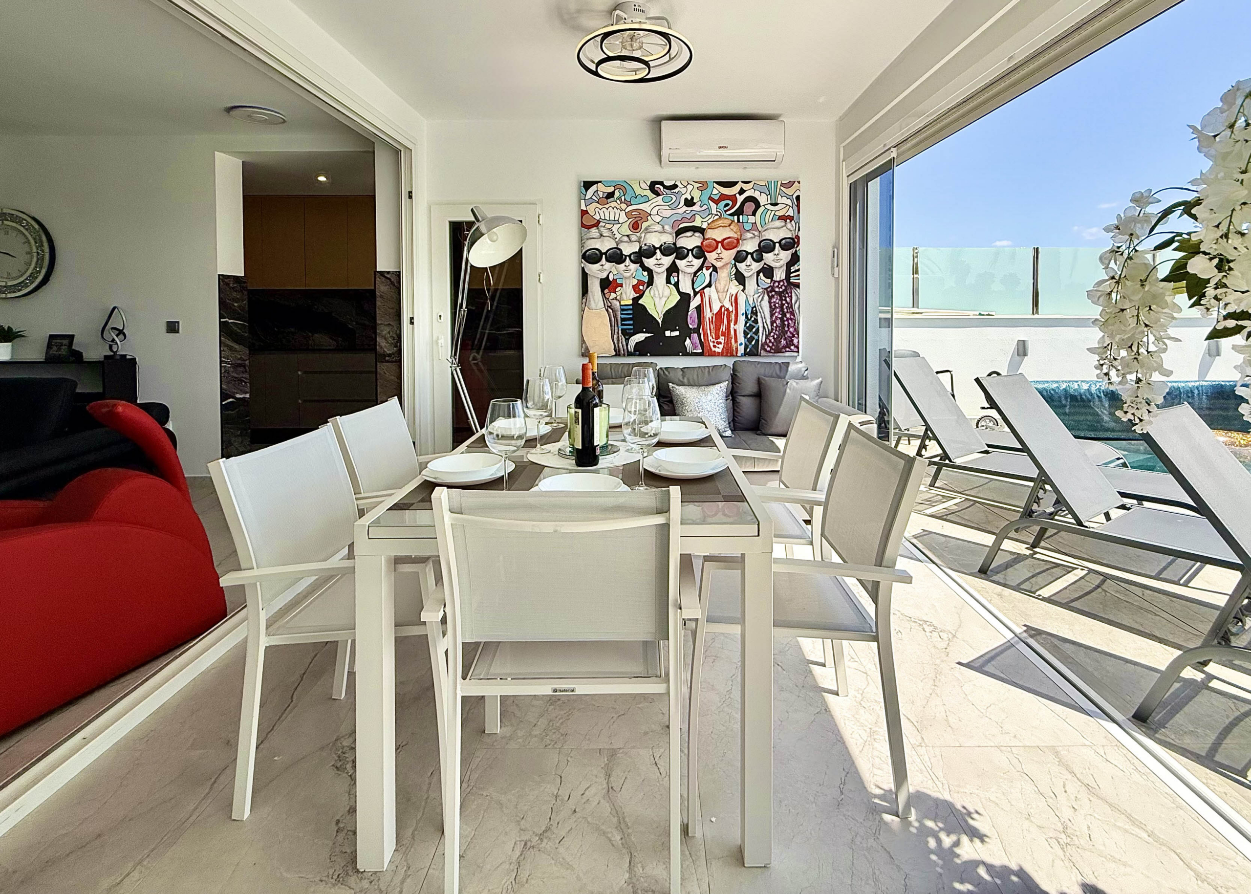 Modern dining area in exclusive villa at Mar Menor Golf Resort marketed by Cristina Lopez