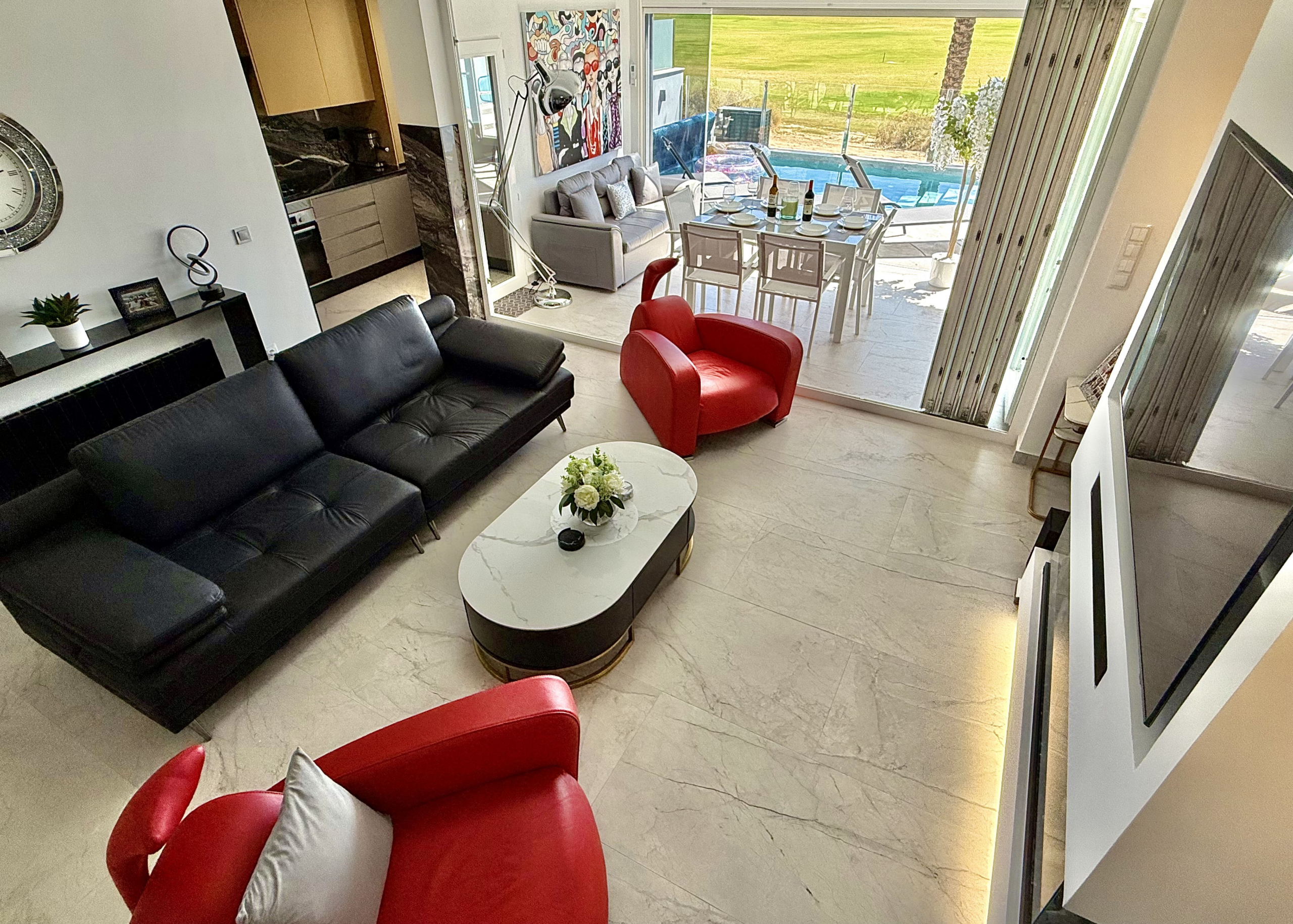 Contemporary living room in luxury Mar Menor Golf Resort villa listed by Cristina Lopez