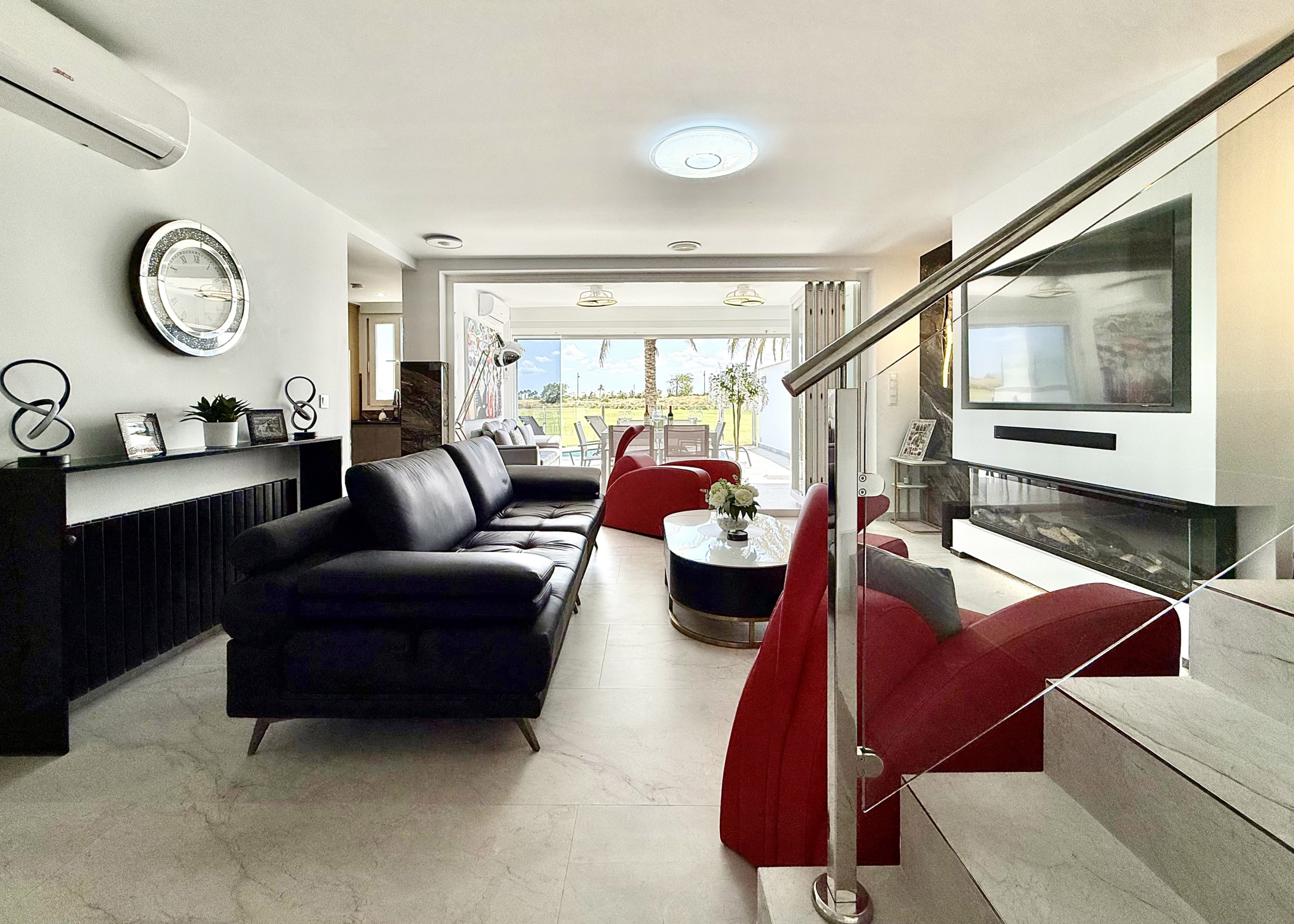 Contemporary living room in luxury Mar Menor Golf Resort villa listed by Cristina Lopez